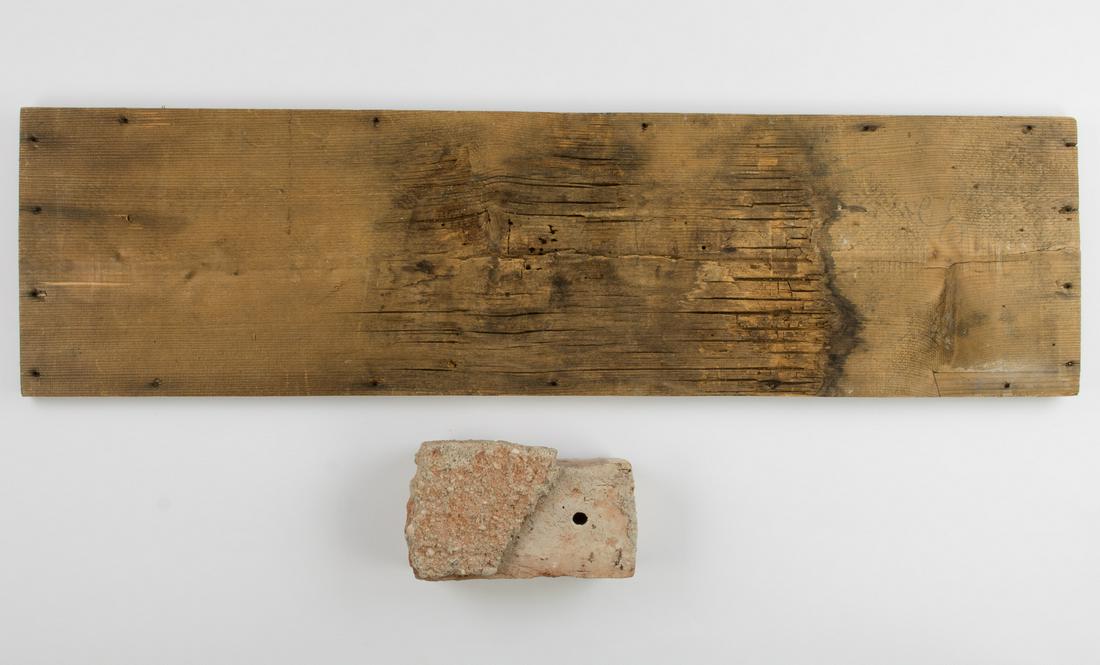 A BRICK AND A WOODEN PANEL FROM MARTIN BORMANN'S HOUSE IN OBERSALZBERG: Rare pair of relic-condition building materials salvaged from the Obersalzberg house of MARTIN BORMANN (1900 - 1945), the 'proprieter' of Obersalzberg during the Third Reich, including a wooden panel,