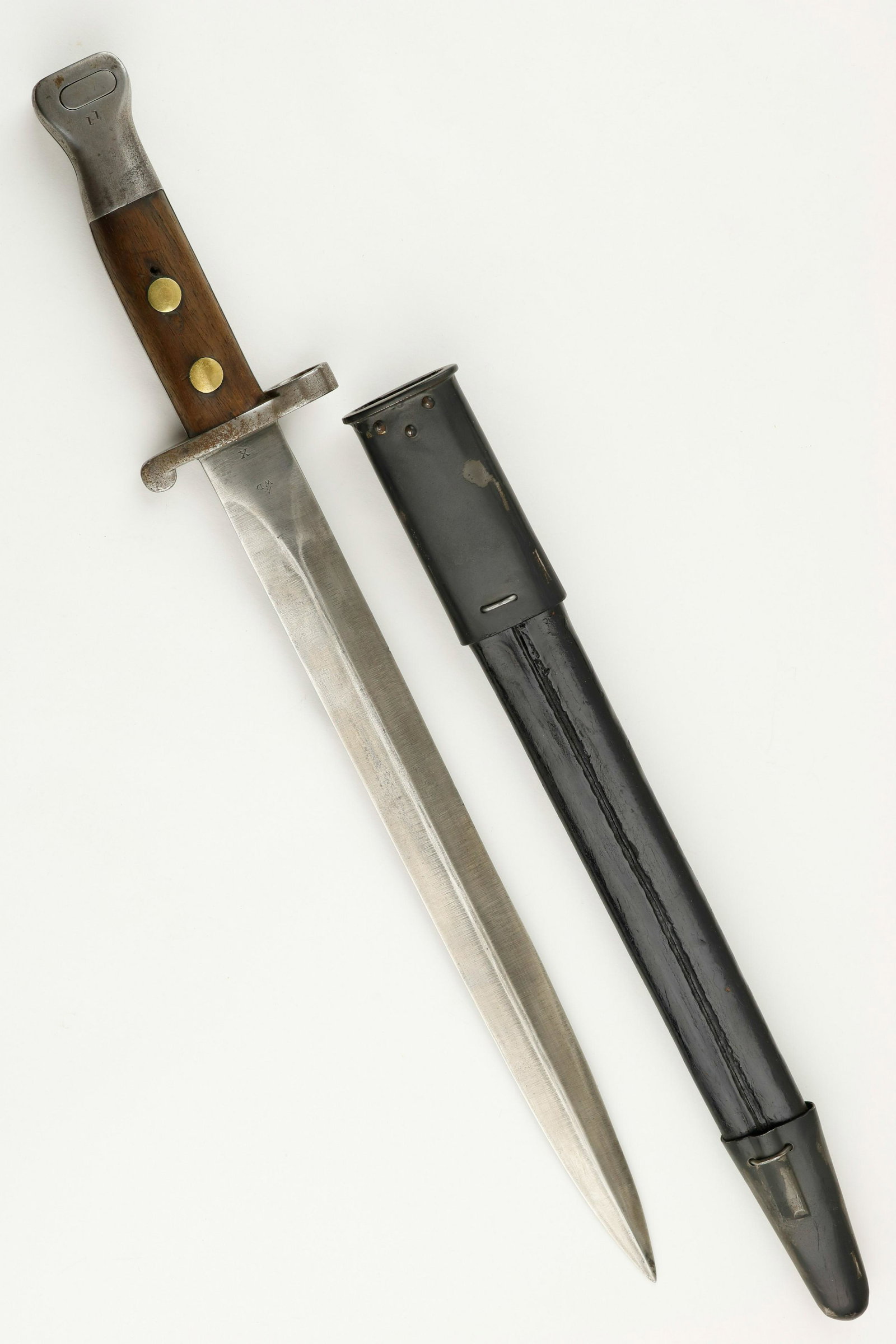 WWI BRITISH 1888 MKI TYPE II BAYONET AND SCABBARD: Bayonet,12 in. long blade with an overall length of 16.5 in., for the P-14 Enfield Rifle. Nice late Victorian Era British Pattern of 1888 bayonet, made to fit the Magazine Leeâ€“Metford Rifle, of