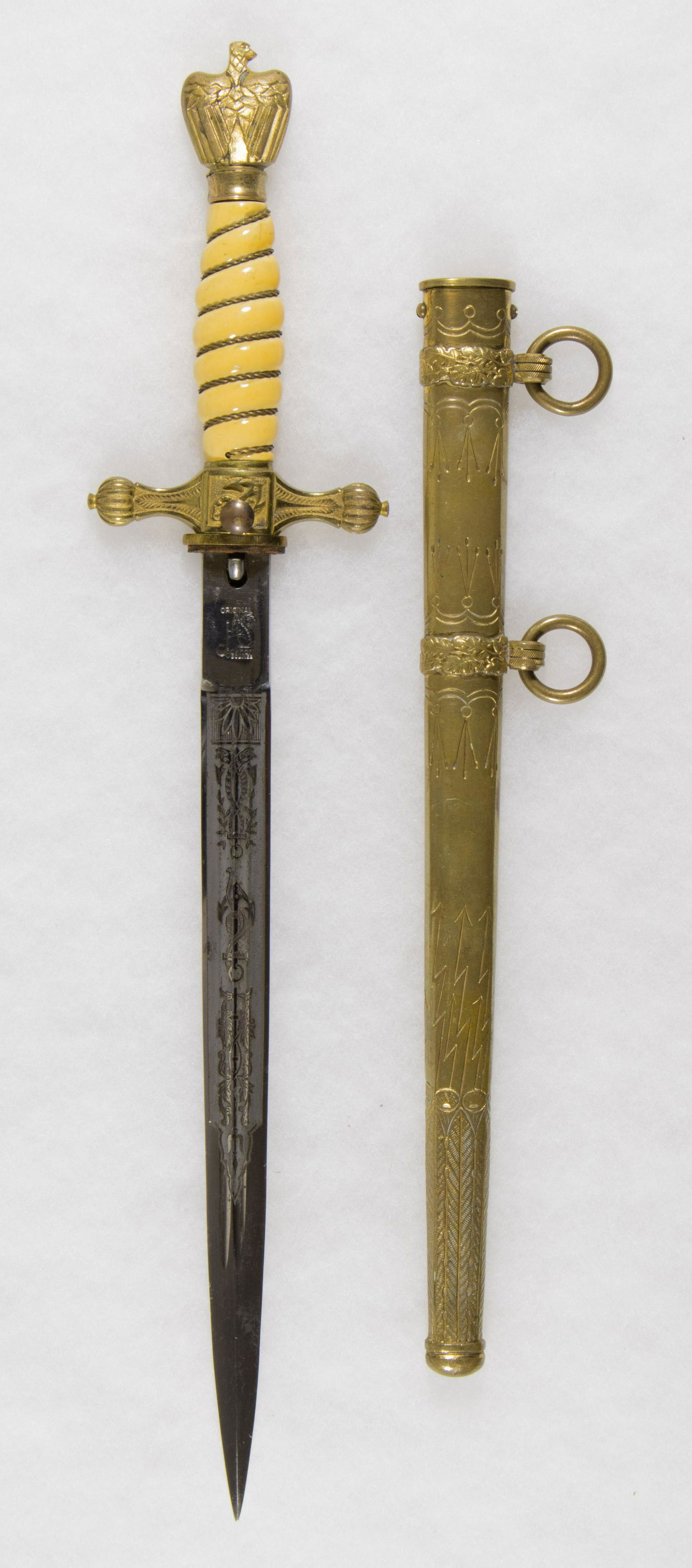 KRIEGSMARINE DAGGER BY EICKHORN: Third Reich second model Kriegsmarine dagger by Eickhorn, 10 in. blade, 16.25 in. overall, with a white celluloid-covered wood grip, wrapped with tightly-bound braided brass wire. The pommel is in the