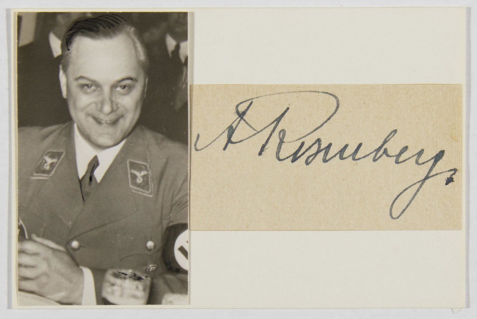 ALFRED ROSENBERG: (1893 - 1946) Nazi leader considered the ideologist of Nazism, Reichsminister of the eastern territories, executed at Nuremberg. Bold signature 'A. Rosenberg' on a 2.75 x 1.5 in. slip, mounted beside 