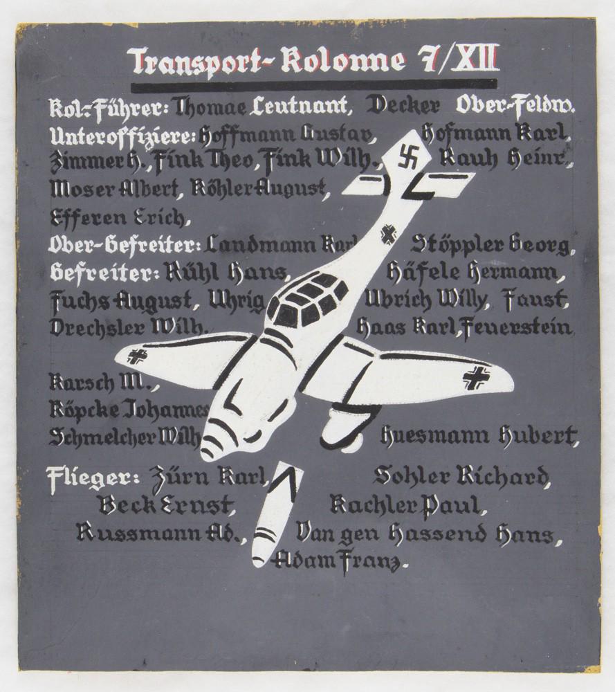 LIUFTWAFFE TRANSPORT COLUMN PLACARD: A likely war-date Luftwaffe item, an 11 x 12.5 in. section of Masonite headed 'Transport-Kolonne 7/XII' The board bears a painted image of a diving Stuka which has just released a bomb, and lists offi