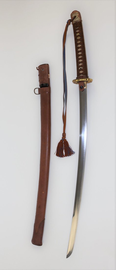 JAPANESE ANCESTRAL SAMURAI SWORD KOTO BLADE WITH SCABBARD: Absolutely beautiful Koto period Japanese sword; a Type 98 Shin Gunto, measuring 27 in. from the 'kissaki' (â€˜tip') to the â€˜habaki' (â€˜stop'), and 36.5 in. overall. No maker's signatur