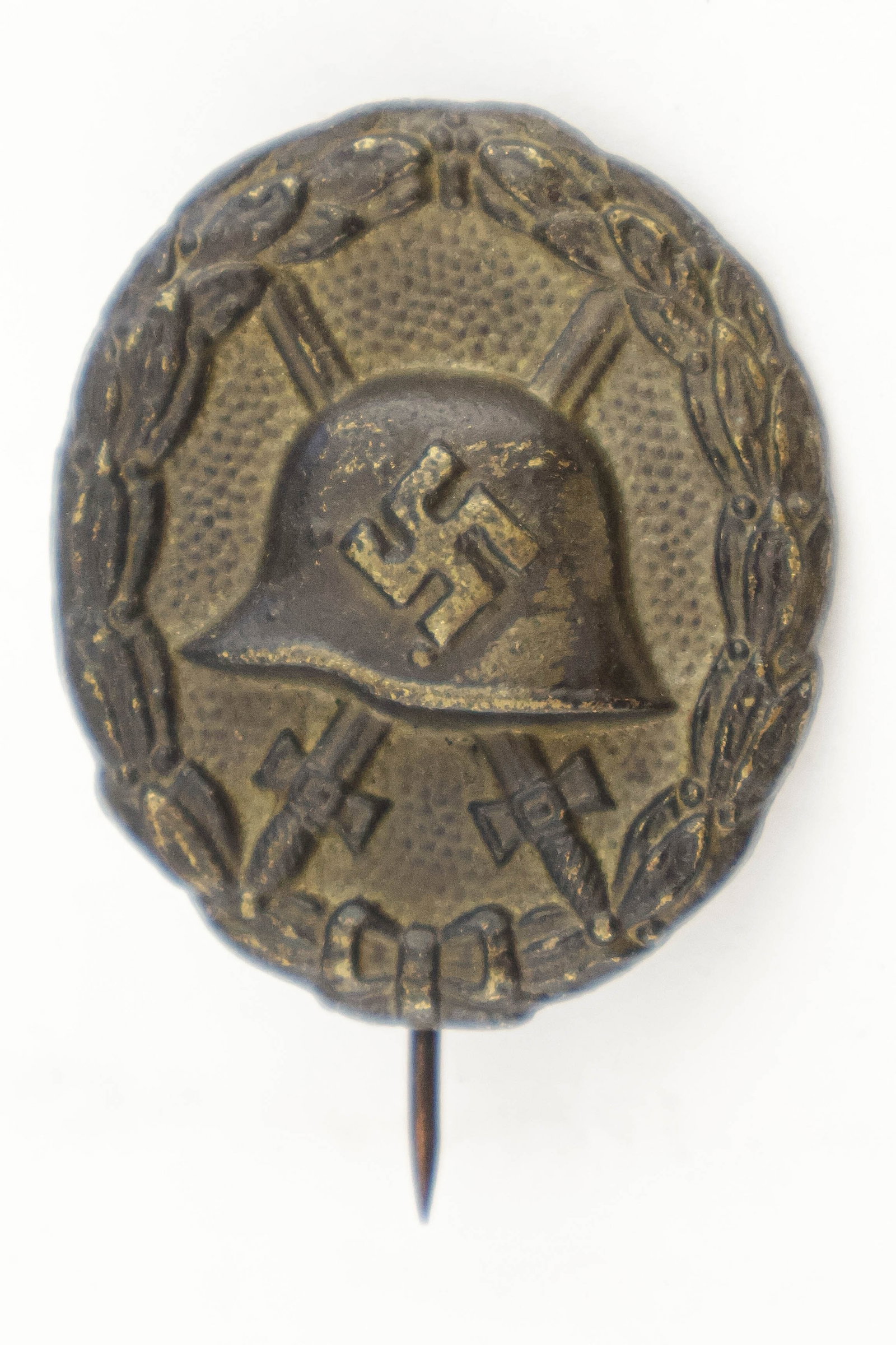 EARLY GERMAN WOUND BADGE IN BLACK: Very early Third Reich German Wound Badge in Black, hollow back, with single stickpin soldered to the reverse. Very good. This was the earliest of this type of Wound Badge, dating to the conquest of P