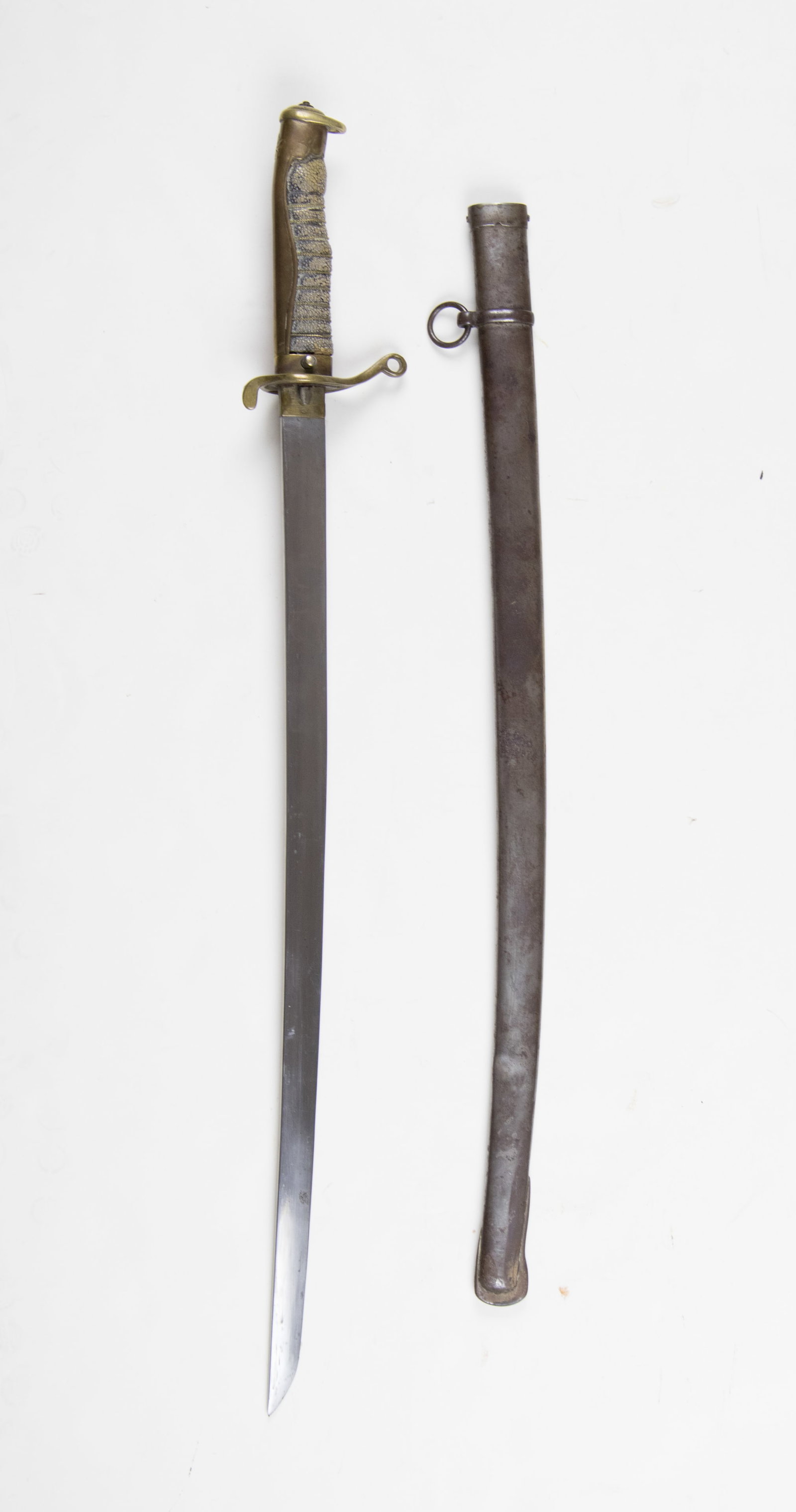 IMPERIAL JAPANESE POLICE SHORT SWORD: Japanese short sword belonging to a policeman, 22 in. blade and 28 in. overall, with a fish skin grip that has been wire wrapped. The brass wire is slightly loose in some places. The back of the handl