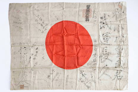 JAPANESE ‘GOOD LUCK’ FLAG WITH TEMPLE STAMPS: Japanese national flag, 38 x 28 in., silk construction. The flag is covered with Japanese writing in black ink, untranslated but almost certainly wishes of good luck and exhortations to destroy the en