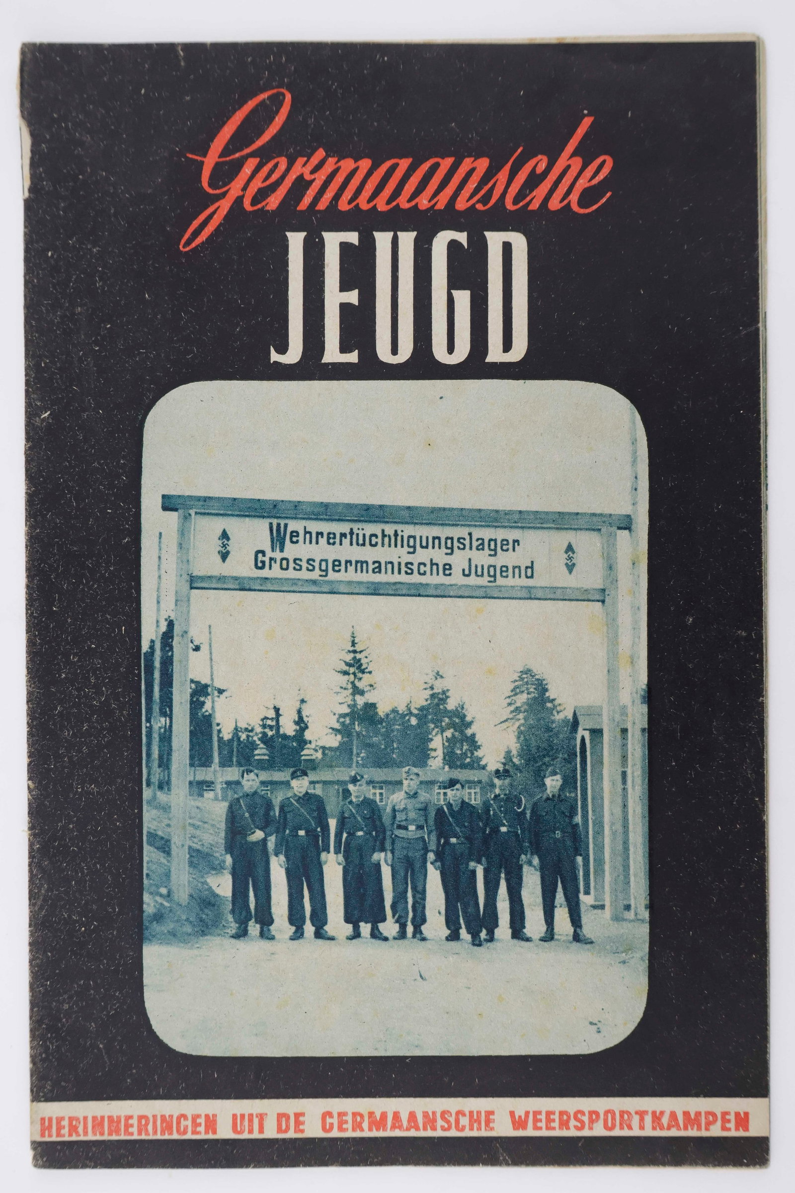 NAZI RECRUITMENT OF FLEMISH YOUTH: Rare propaganda booklet: 'Germaansche Jeugd' ('German Youth'), 32pp. 8vo., Brussels, 1944, in Flemish. The Germans very cleverly attempted to entice Flemish boys to enlist through the use of organizat