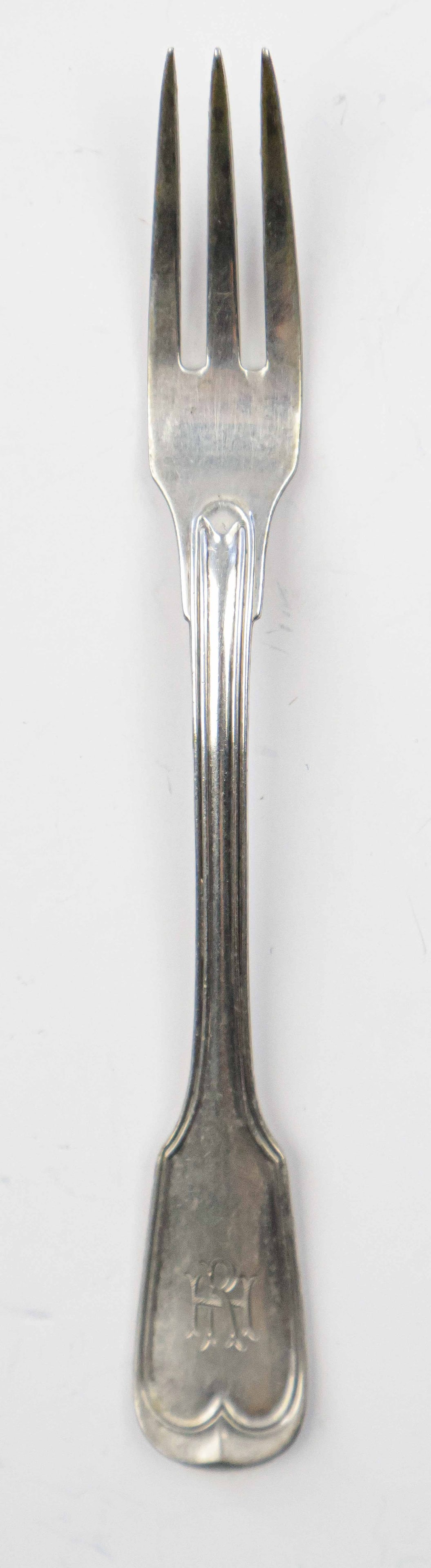 RUDOLF HESS HORS D’ OEUVRES FORK: Silver hors d’ oeuvres fork, 5.5 in. long, once owned and used by Nazi Party secretary Rudolf Hess. The three-tine fork was likely for common, everyday use, featuring a simplistic design, though