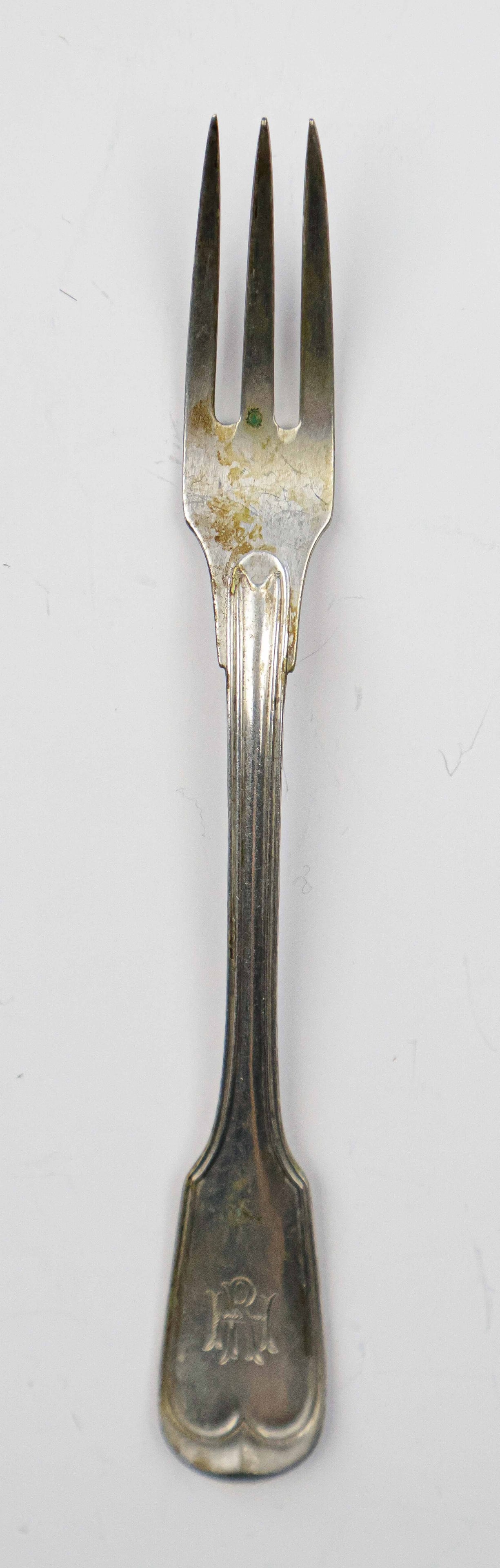 RUDOLF HESS HORS D’ OEUVRES FORK: Silver hors d’ oeuvres fork, 5.5 in. long, once owned and used by Nazi Party secretary Rudolf Hess. The three-tine fork was likely for common, everyday use, featuring a simplistic design, though
