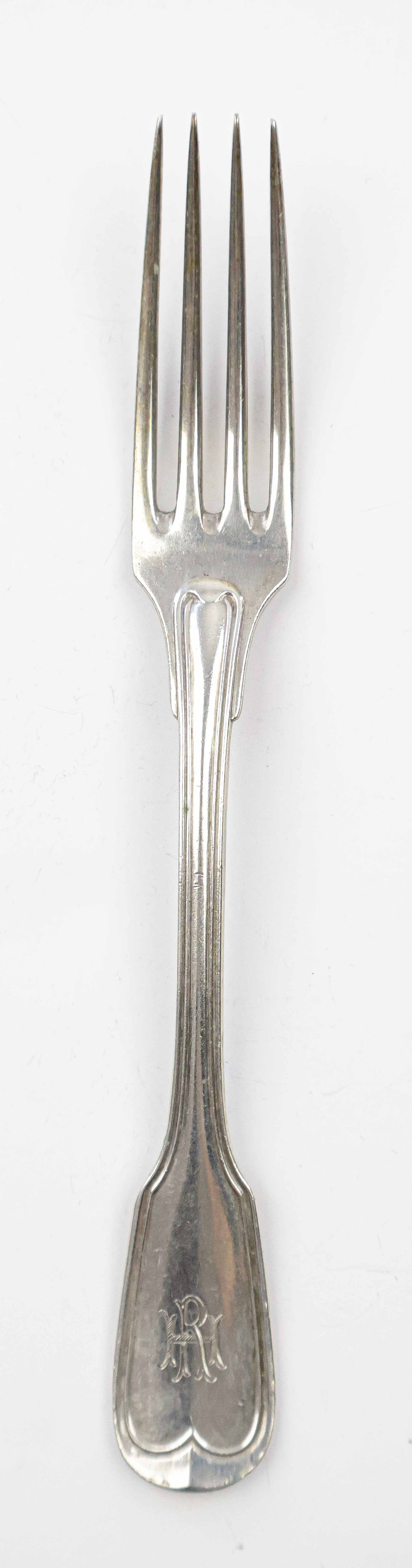 RUDOLF HESS LUNCHEON FORK: Silver luncheon fork, 7 in. long, once owned and used by Nazi Party secretary Rudolf Hess. The four-tine fork features a simplistic design, though still displays the ornate engraving of his initials &