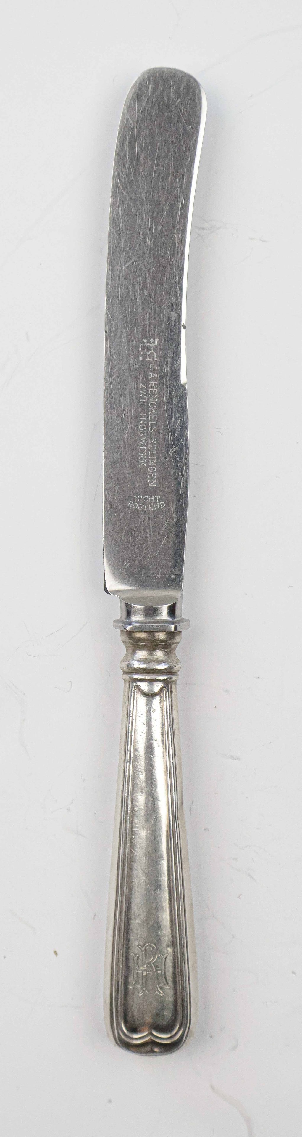 RUDOLF HESS LUNCHEON KNIFE: Silver luncheon knife, 8 in. long, once owned and used by Nazi Party secretary Rudolf Hess. The knife features a simplistic design, though still displays the ornate engraving of his initials ‘R 
