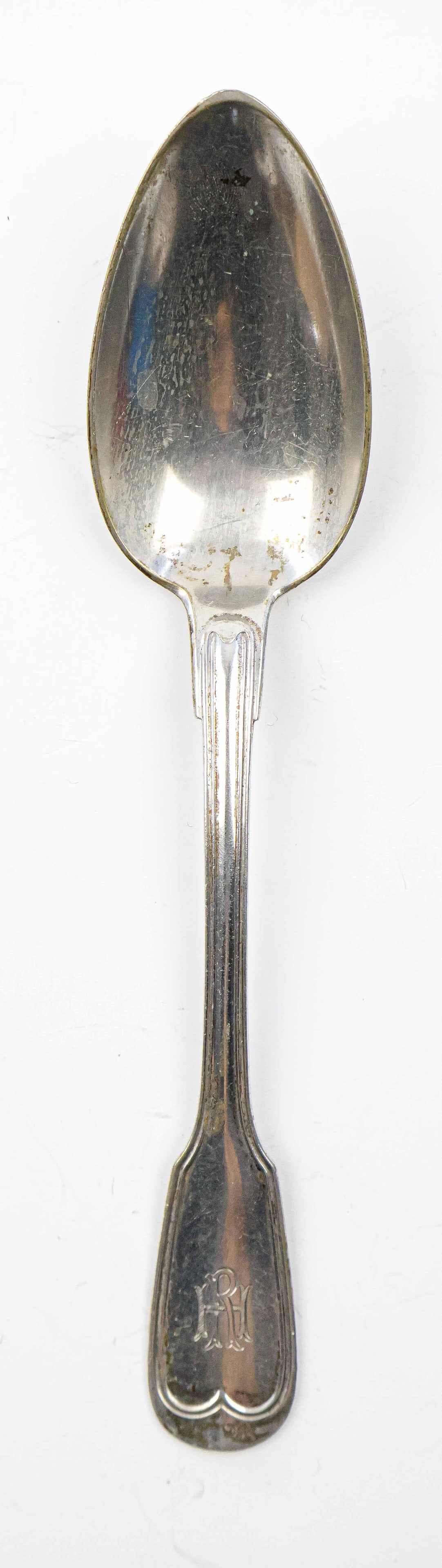 RUDOLF HESS SOUP SPOON: Silver soup spoon, 8.5 in. long, once owned and used by Nazi Party secretary Rudolf Hess. The spoon features a simplistic design, though still displays the ornate engraving of his initials ‘R H&