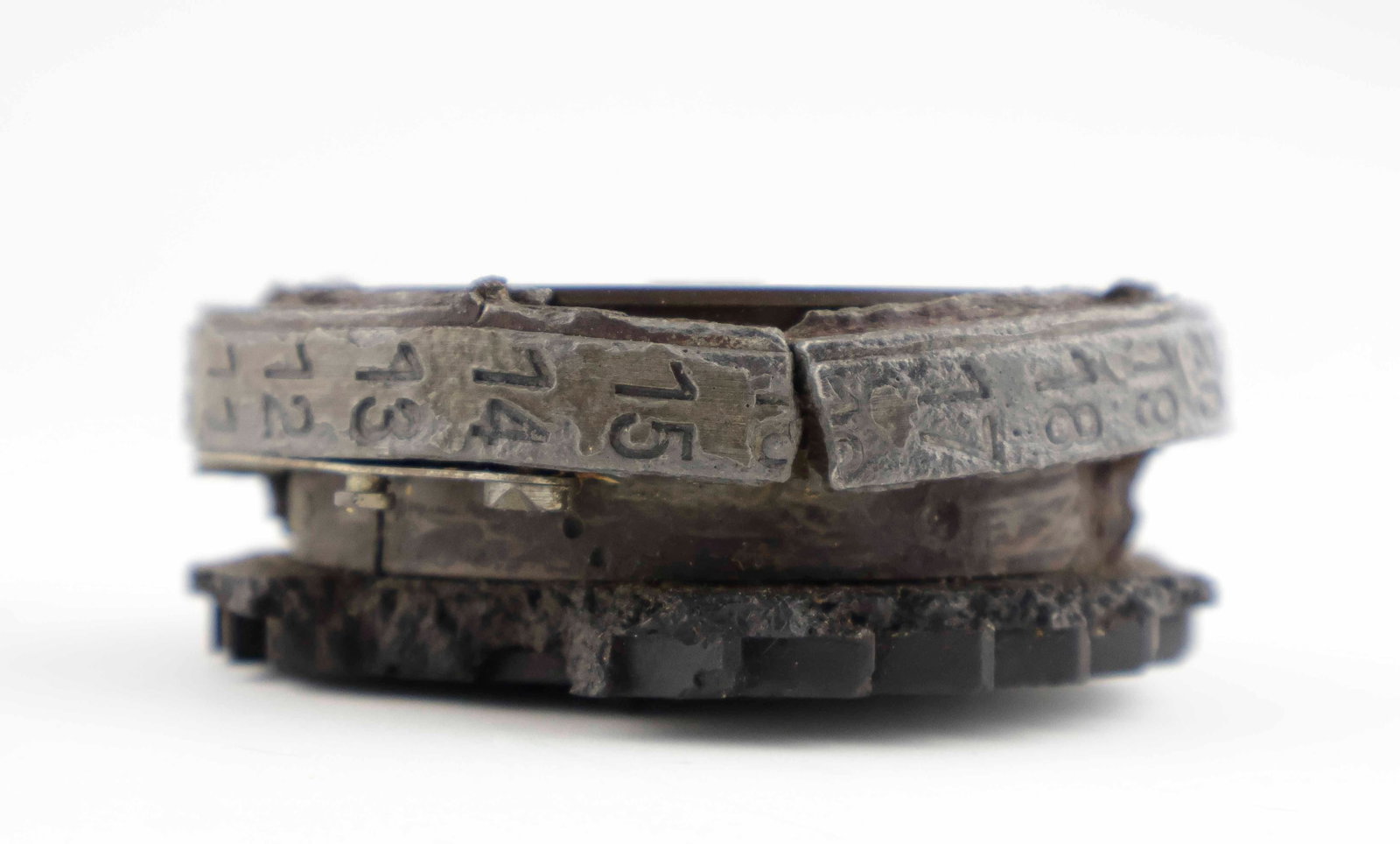 ENIGMA MACHINE ROTOR WHEEL: Especially rare ENIGMA machine rotor wheel recovered from a sunken German submarine. The wheel measures 3 in. in diameter and is one inch thick. It is comprised of several pieces screwed together, inc