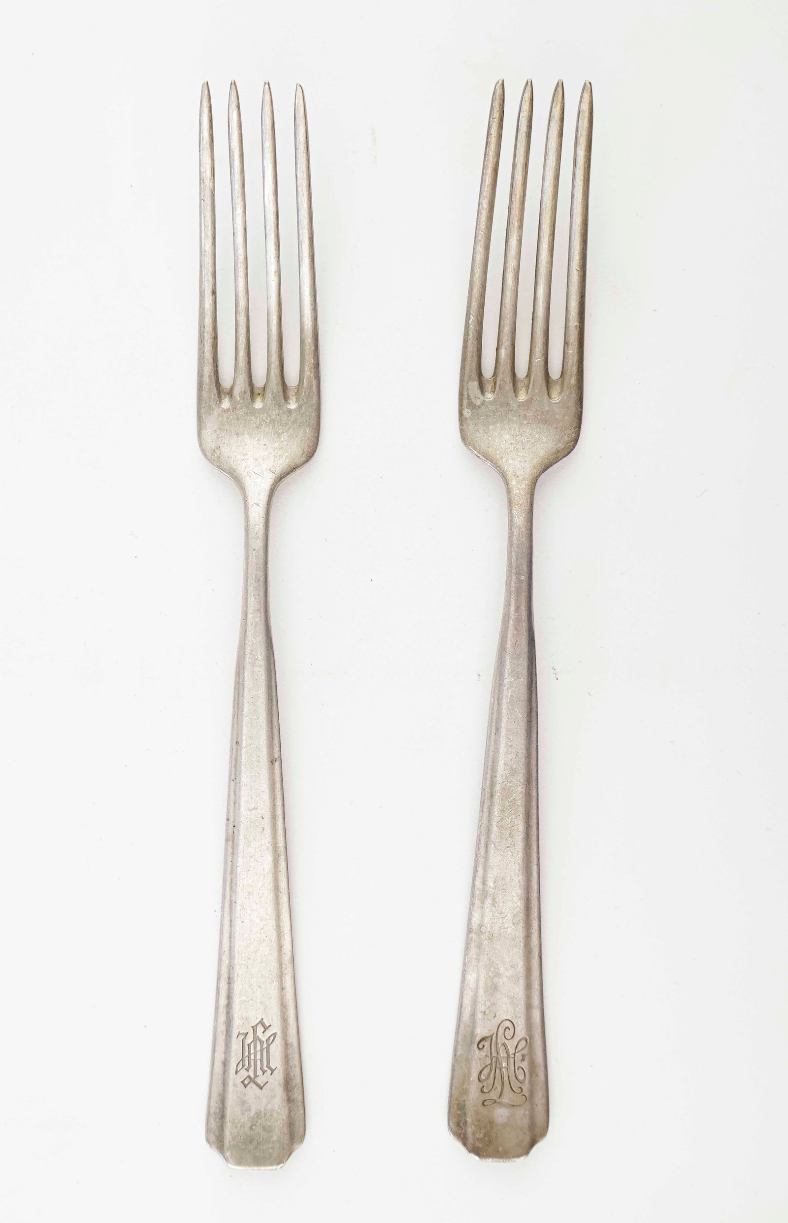 LIEBSTANDARTE ADOLF HITLER SILVERWARE (2): Pair of near identical silver-plated forks, 8.5 in. long, bearing the ‘LAH’ monogram in slightly differing scripts. Both bear the maker mark ‘WMF’ for Wurttembergische Metallwa
