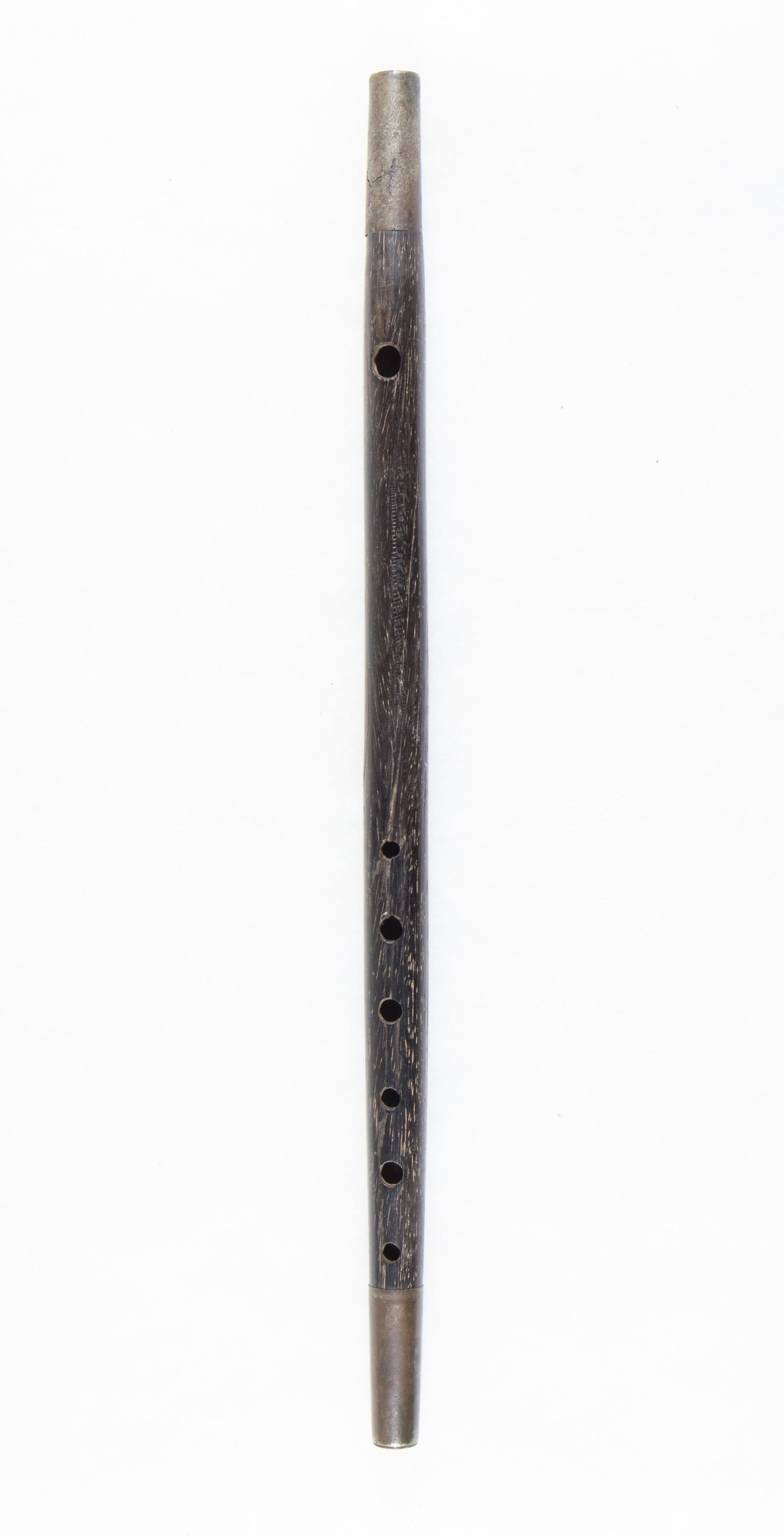 CIVIL WAR FIFE: Ebony Civil War fife, 17 in. long, silver ferrules at either end, showing heavy oxidation. Two near full-length cracks in the wood make it in quite delicate state. No discernible markings. Sold as is.