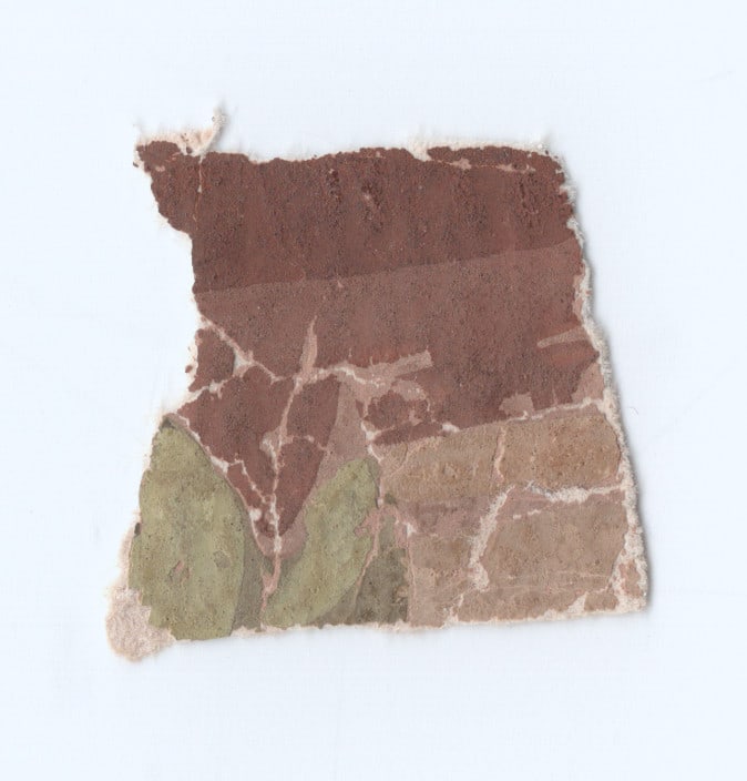 ABRAHAM LINCOLN ASSASSINATION RELIC: A rare Lincoln relic, a small swath of original wallpaper from the room in the Petersen House where Lincoln died. The swath measures approx. .75 in. square, and was obtained by original owner’s 