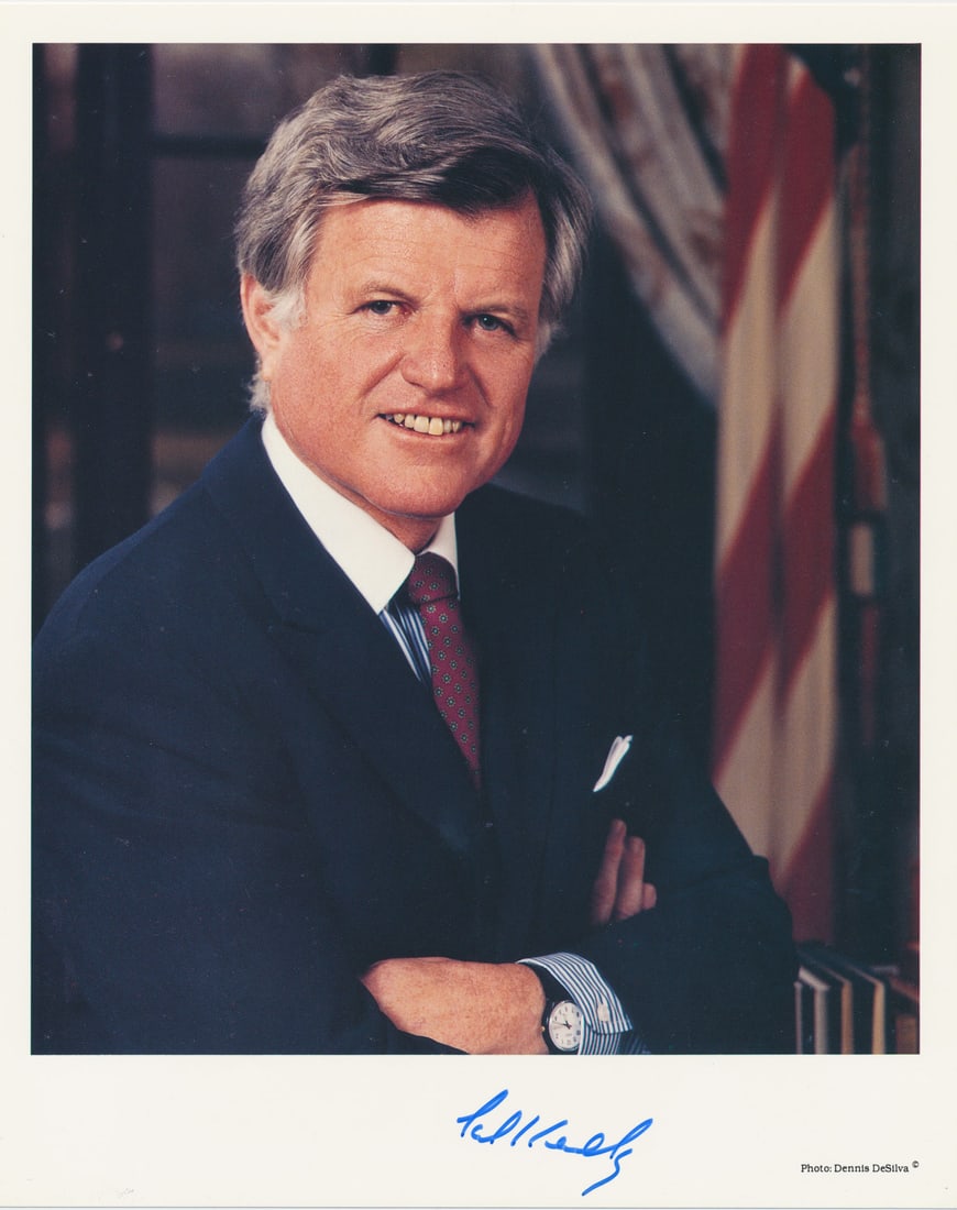 EDWARD KENNEDY: (1932-2009) Democratic senator from Massachusetts, brother of John F. Kennedy and Robert Kennedy. S.P., 8 x 10 in. color, a standing chest-up portrait, signed in blue ink at the lower margin. In fine