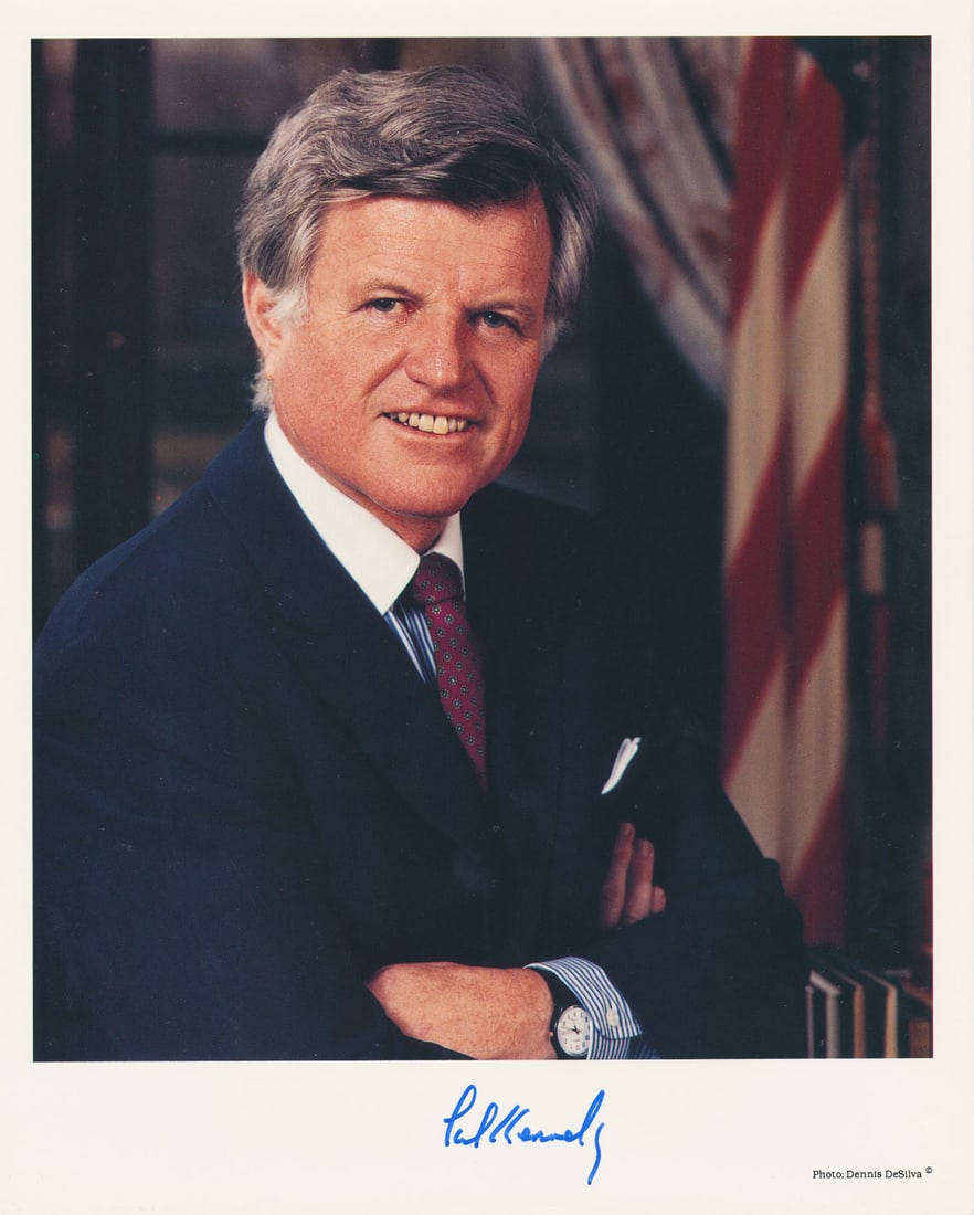EDWARD KENNEDY: (1932-2009) Democratic senator from Massachusetts, brother of John F. Kennedy and Robert Kennedy. S.P., 8 x 10 in. color, a standing chest-up portrait, signed in blue ink at the lower margin. In fine