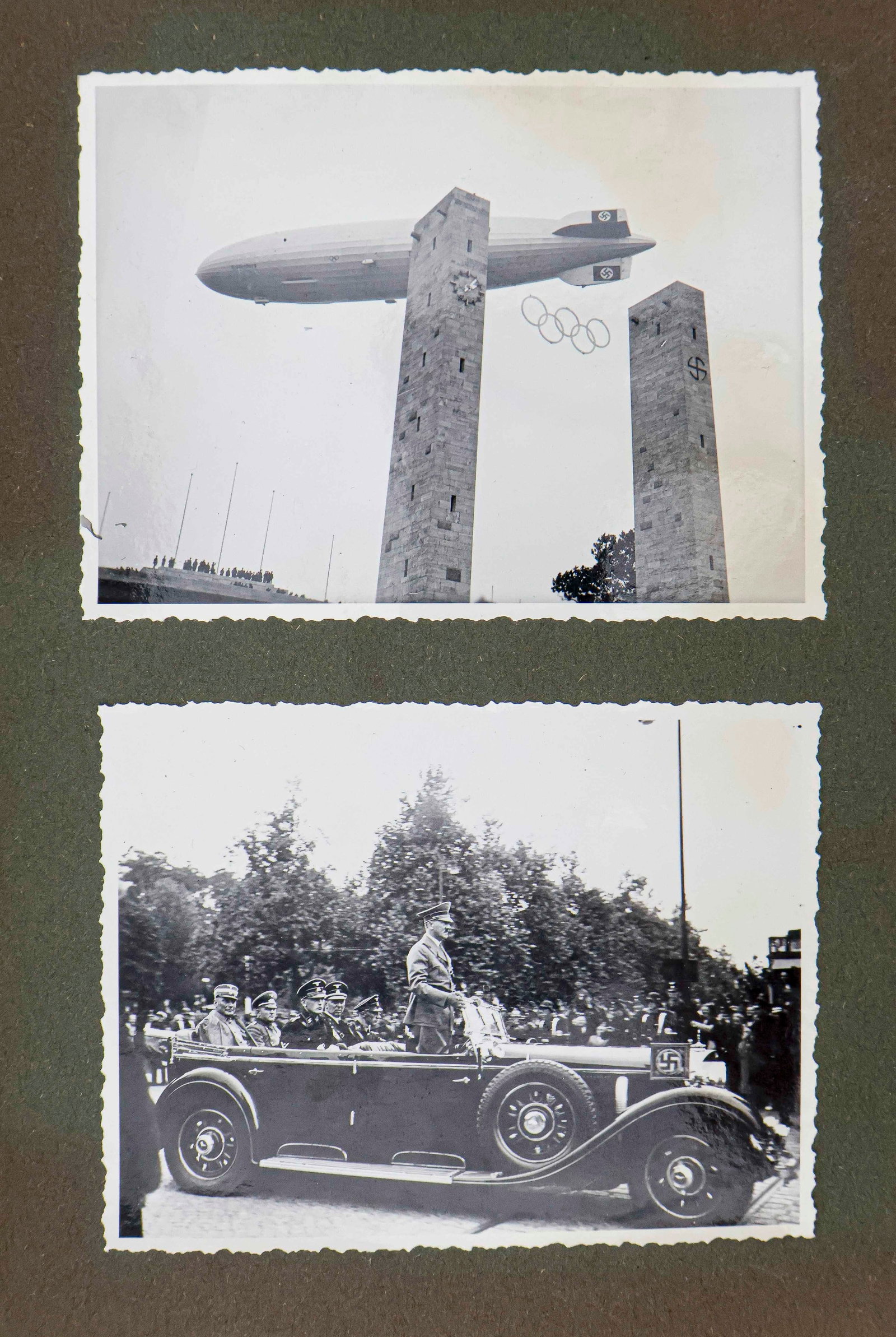 ‘BROUGHT BACK’ 1936 BERLIN OLYMPICS PHOTO ALBUM: Period photo album, 8 x 9.5 in. with green leather covers and bound together with black string. The album contains a mix of 158 commercial and original photos of the 1936 Berlin Olympics. Content incl