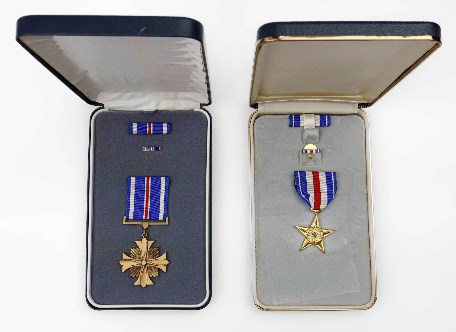 CASED AMERICAN DISTINGUISHED FLYING MEDAL AND SILVER STAR MEDAL: Cased Distinguished Flying and Silver Star medals, both in original cases and in fine condition.