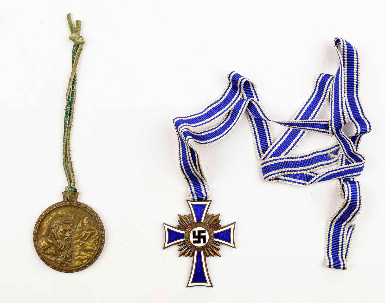 MOTHER’S CROSS IN BRONZE: A Nazi awarded Mother's Cross in bronze with ribbon. Fine condition. WITH: a medal honoring Ullr, patron saint of winter sports, with enameled flower on the obverse with text ‘Nederhorn’, 
