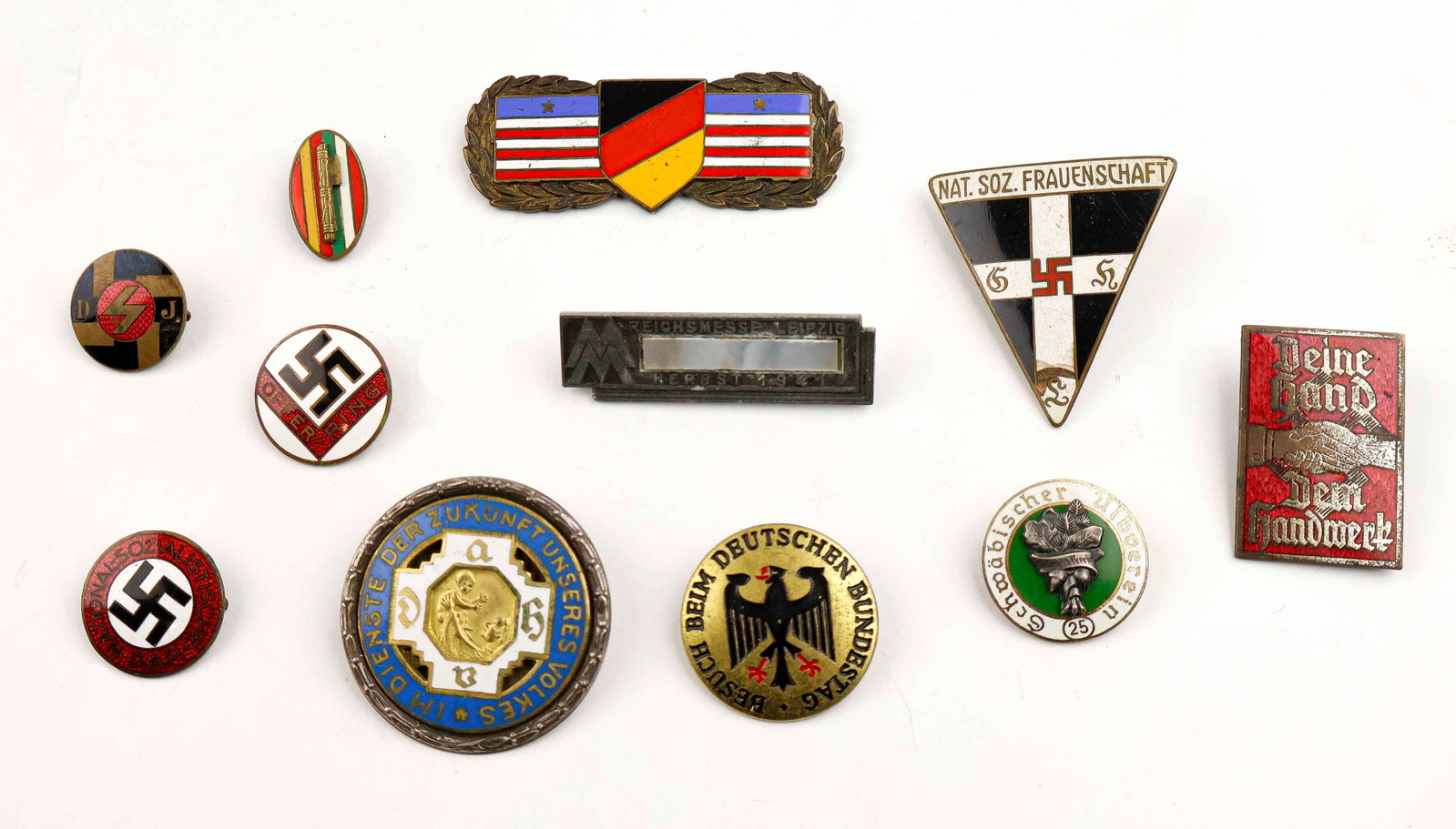THIRD REICH ERA BADGE COLLECTION (10): A collection of ten badges, includes a desirable Reichshebammenabzeichen ‘Im Dienste der Zukunft unseres Volkes’ badge stamped ‘Silber’ on the verso. WITH: an NSDAP ‘Oper