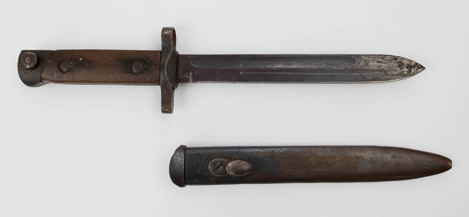1938 MANNLICHER-CARCANO BAYONET: Italian Model 1938 Carcano bayonet, 7 in. blade and 11.5 in. overall, used with the Mannlicher-Carcano M1938 Short Rifle. No maker marks on the bayonet or the steel scabbard. Some pitting to the blade