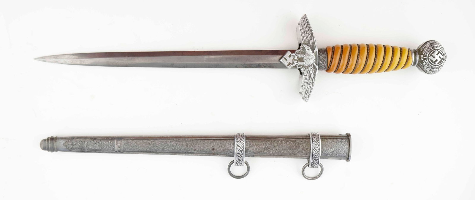 LUFTWAFFE DAGGER, SECOND MODEL: Very nice second model Luftwaffe dagger, 10 in. blade and 15 in. overall. Features a finely detailed round pommel nut with swastika, a tightly wire wrapped grip which has aged to an appealing pumpkin 