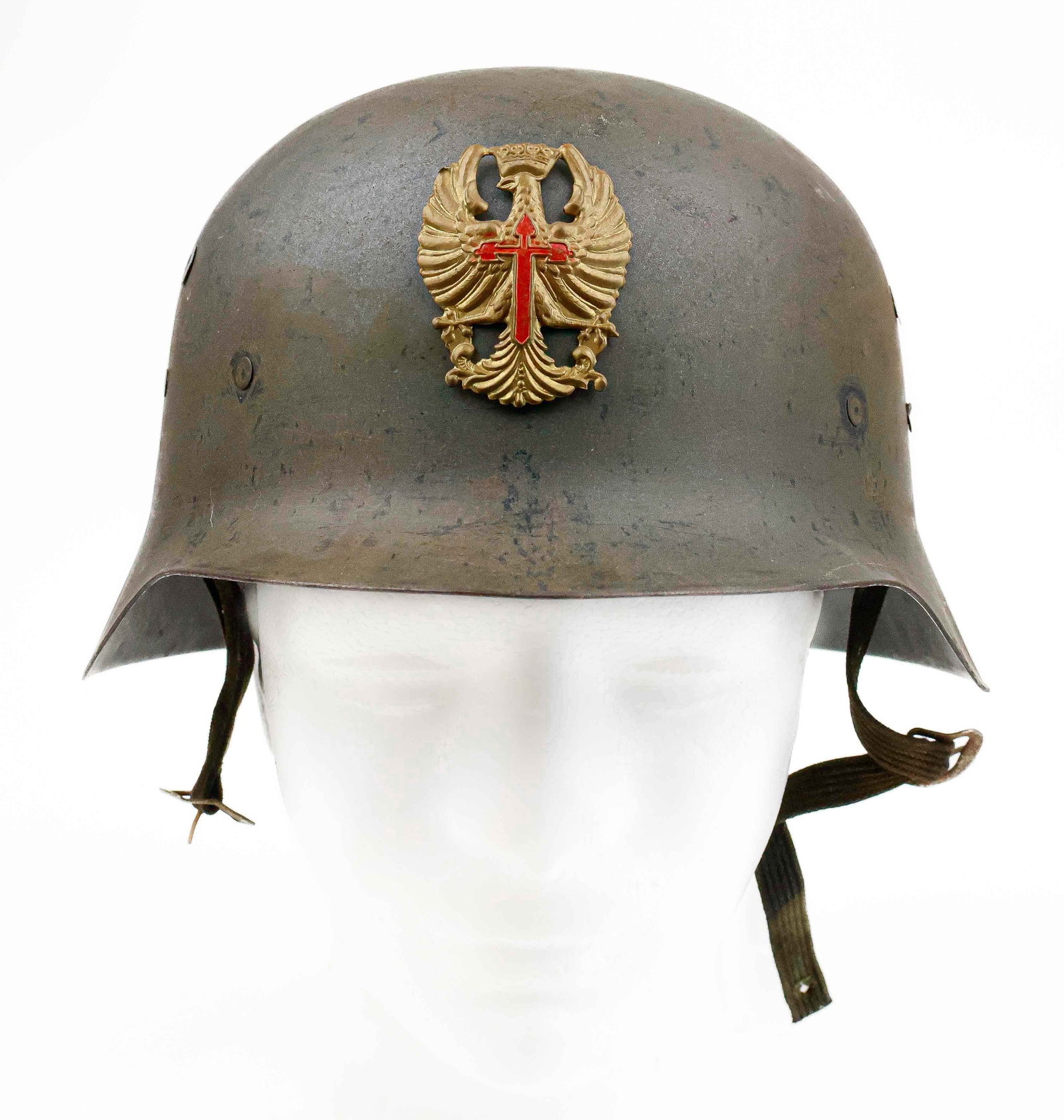 SPANISH CIVIL WAR M2 HELMET: With the outbreak of the Spanish Civil War, the Spanish Republican Government bought nearly all the stock of the helmets that Europe had manufactured, and captured helmets were used by both sides. Hen