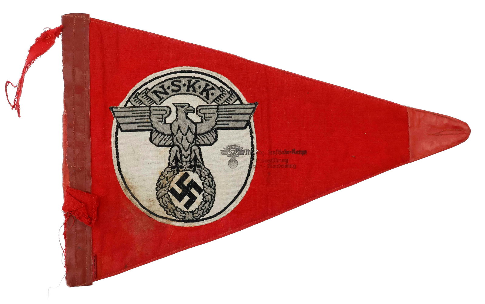 N.S.K.K. CAR PENNANT: Cotton N.S.K.K. pennant, triangular shaped 8.5 x 13 in., two-sided, multi-piece construction of red cloth with an embroidered image of the organization's emblem on both sides. Edge and tip are reinfor