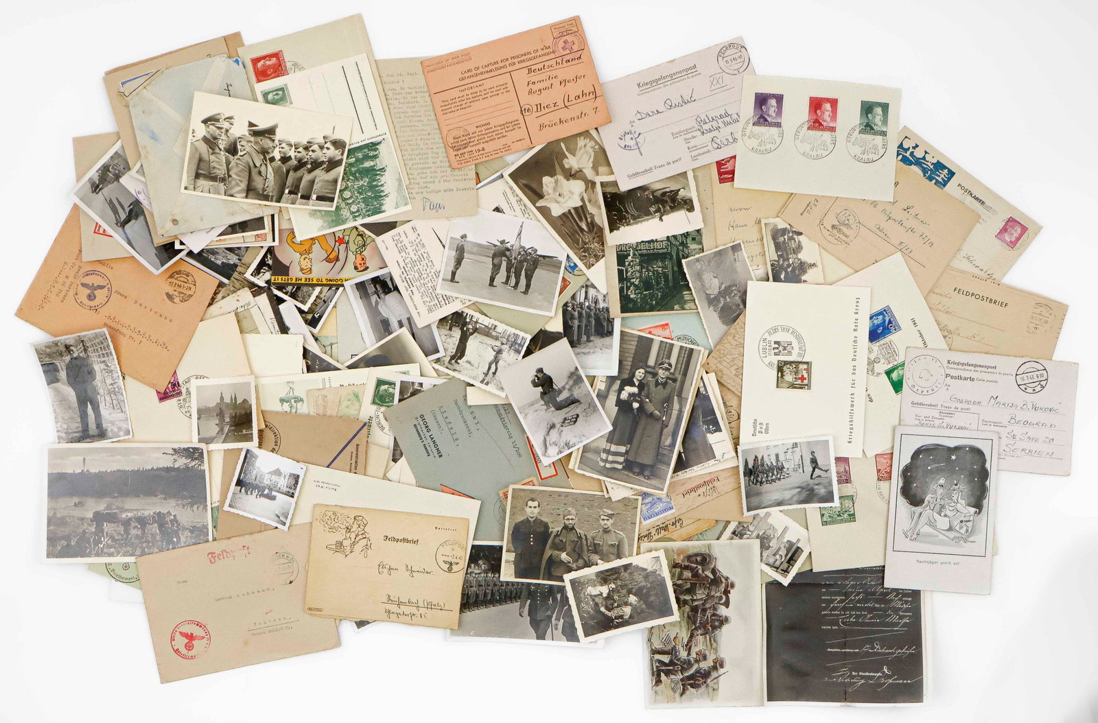 GERMAN WORLD WAR II PHOTOS, POSTCARDS, POW LETTERS AND FELDPOSTS (100+): A super collection of over 100+ original World II German ephemera, including war-date photographs (small format with deckled edges), postcards and postal history items. Original photographs include Ge