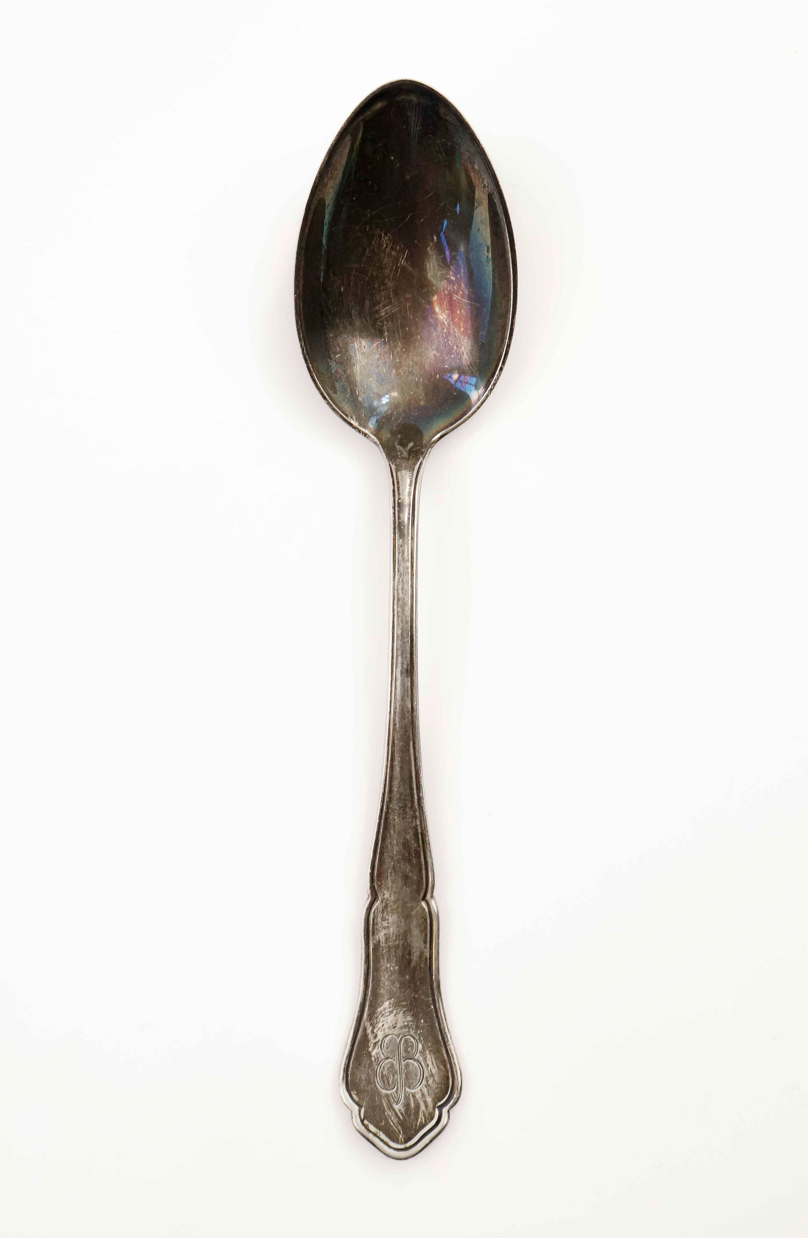 EVA BRAUN SILVER TABLESPOON: An informal sterling silver tablespoon once owned by Adolf's Hitler's wife, Eva Braun. The 8.25 in. utensil fork is relatively simple in design, bearing Braun's period-engraved 'butterfly'-style 'E B'
