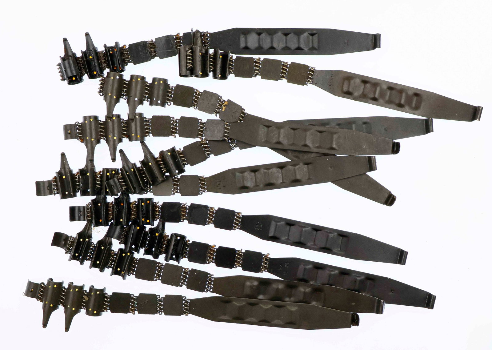 MG34/42 AMMO BELT STARTER TABS (10): Lot of ten German military starter tabs for the 50-round ammo Belt for use with the MG34 and MG42. These steel starter tabs came with every 250-round ammo can and were to be used to ease with loading 