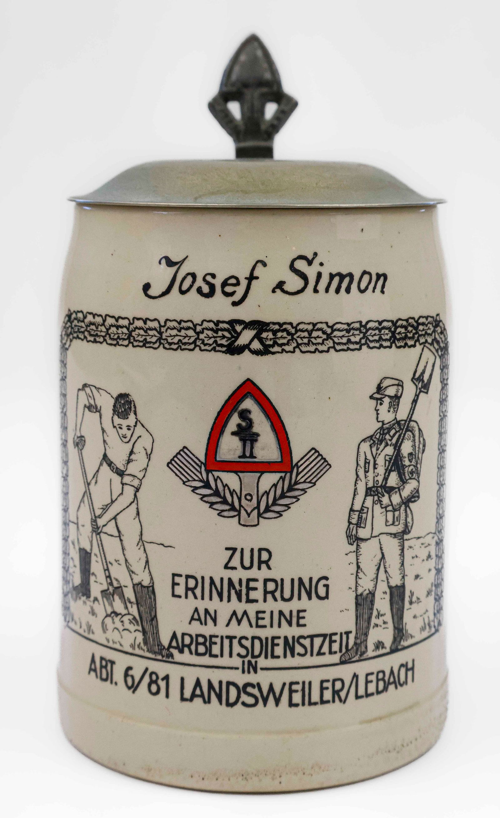THIRD REICH ARBEITDIENSTZEIT BEER STEIN: A commemorative ceramic stein, 5 in. tall x 3.25 dia., presented to Josef Simon commemorating his civilian work in Lebach. With metal lid and in fine condition.