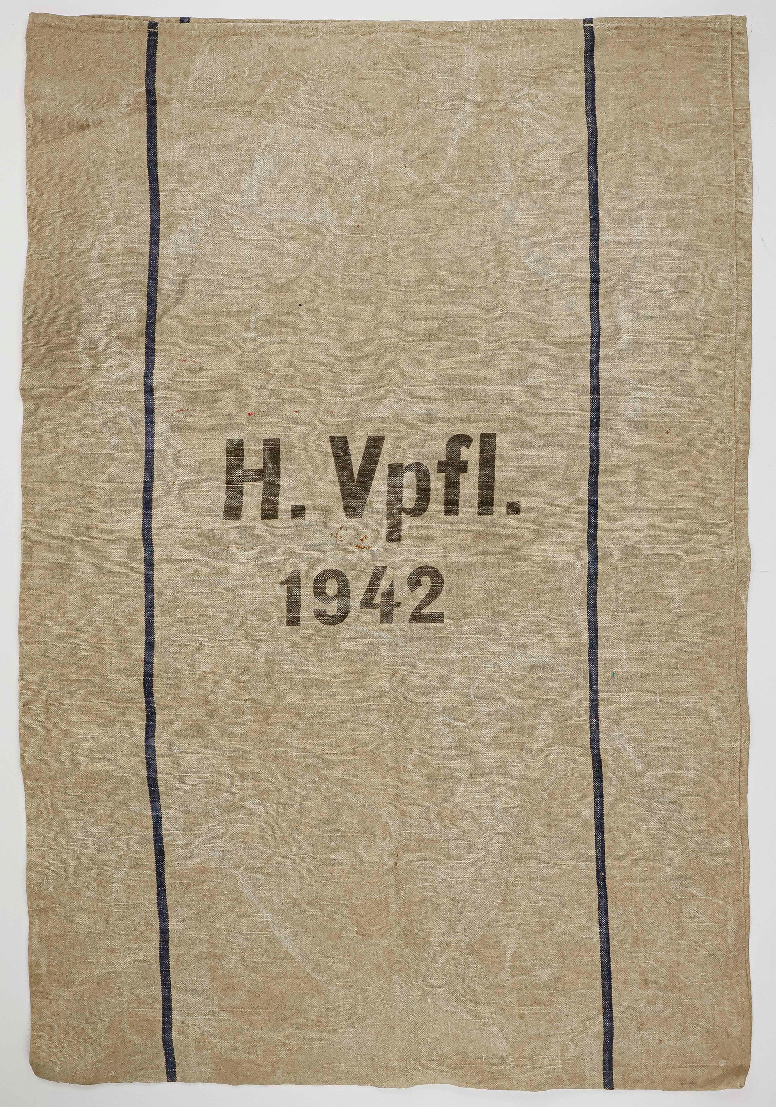 WEHRMACHT SUPPLY SACKS (2): Good lot of two large burlap supply sacks, one 27 x 37.5 in. and the other 28 x 42 in. Both are stenciled with a national eagle and swastika, the designation ‘H. Verpfl.’ (‘Heeresver