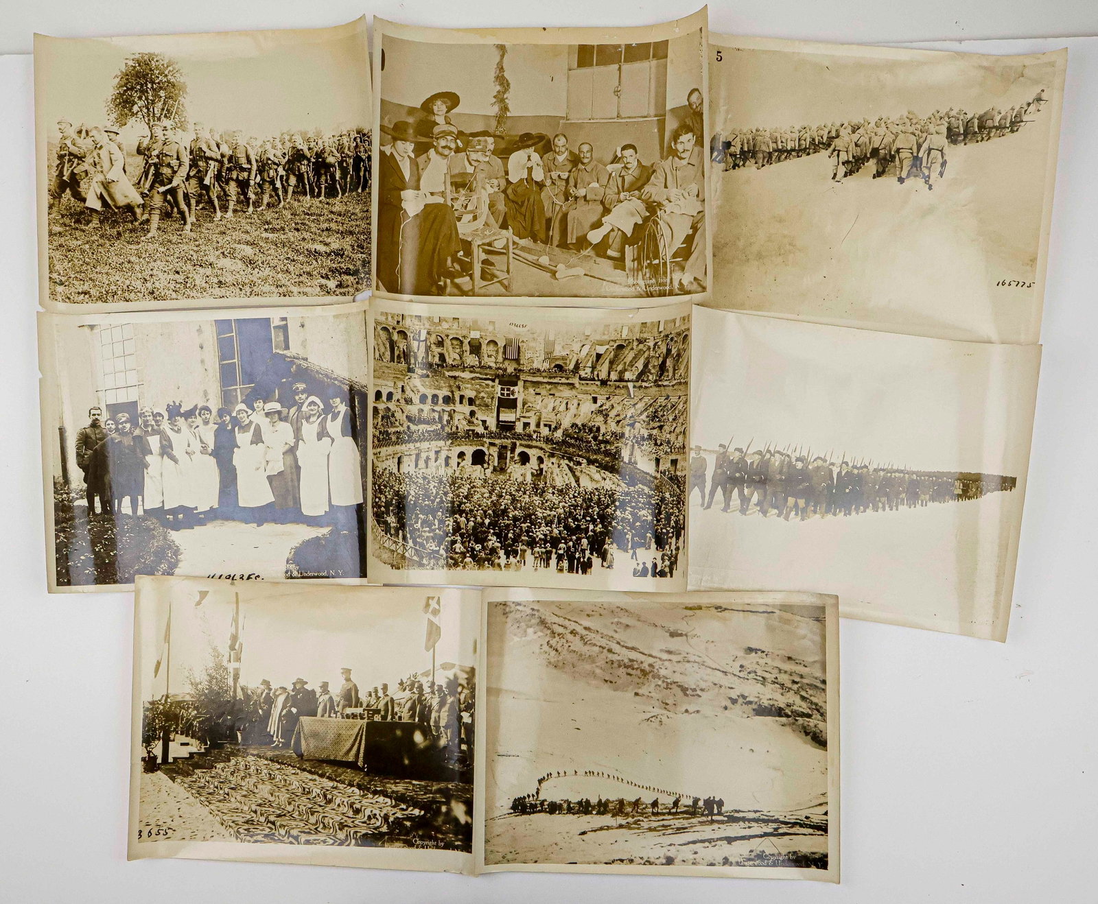 PERIOD OVERSIZED PHOTOGRAPHS OF GERMANS AND ITALIANS AT WAR (8): A set of eight oversized original photographs, each 14 x 11 in., ca. 1918, showing Italian and German (one image) soldiers at war during World War I. Images include Germans marching and brandishing kn