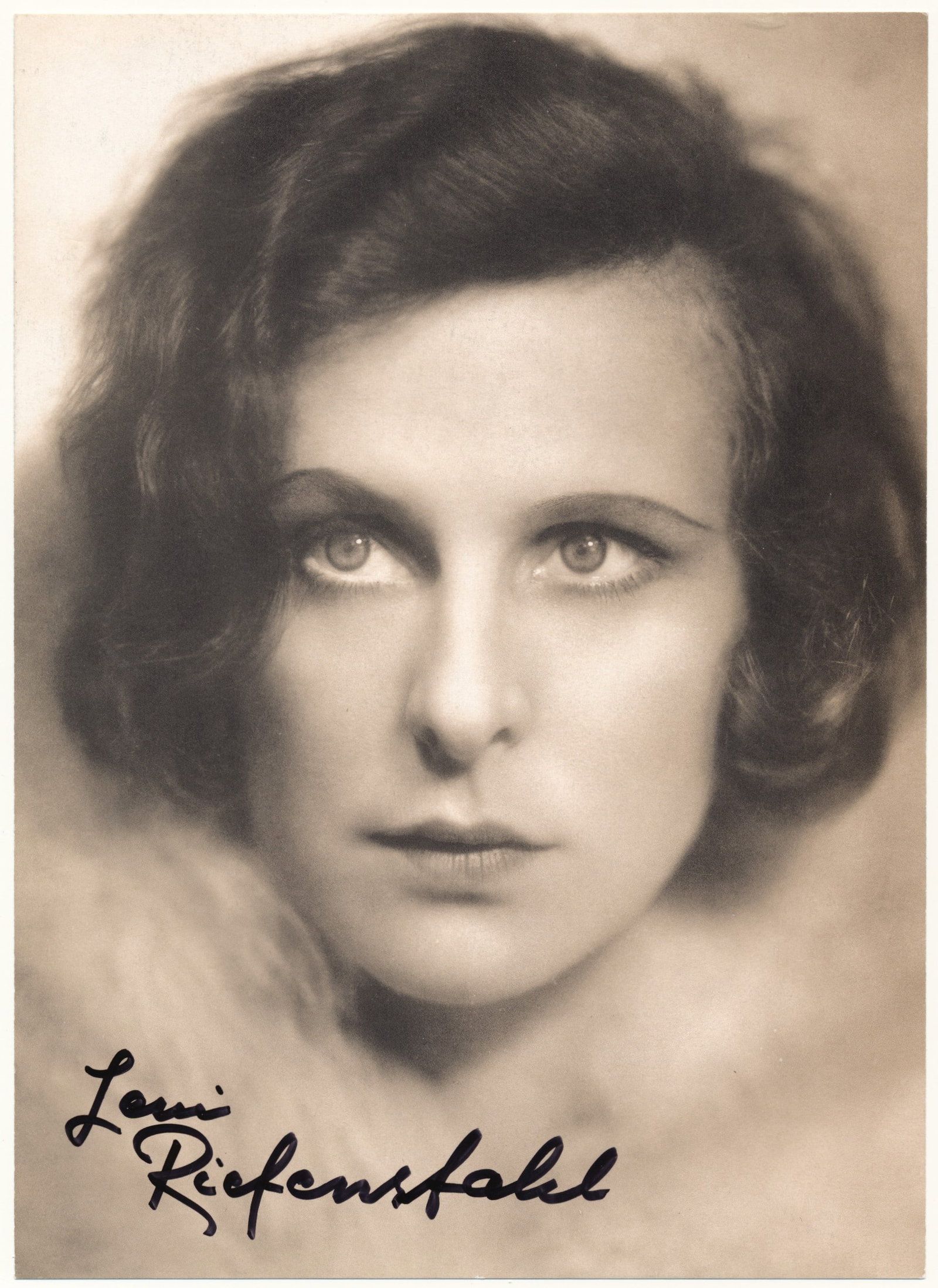 LENI RIEFENSTAHL: (1902 - 2003) German film director, an intimate friend of Hitler who filmed the propaganda classic, Triumph of the Will. S.P., 6 x 8.5 in. b/w, a glamorous close-up, boldly signed later in life. Fine.