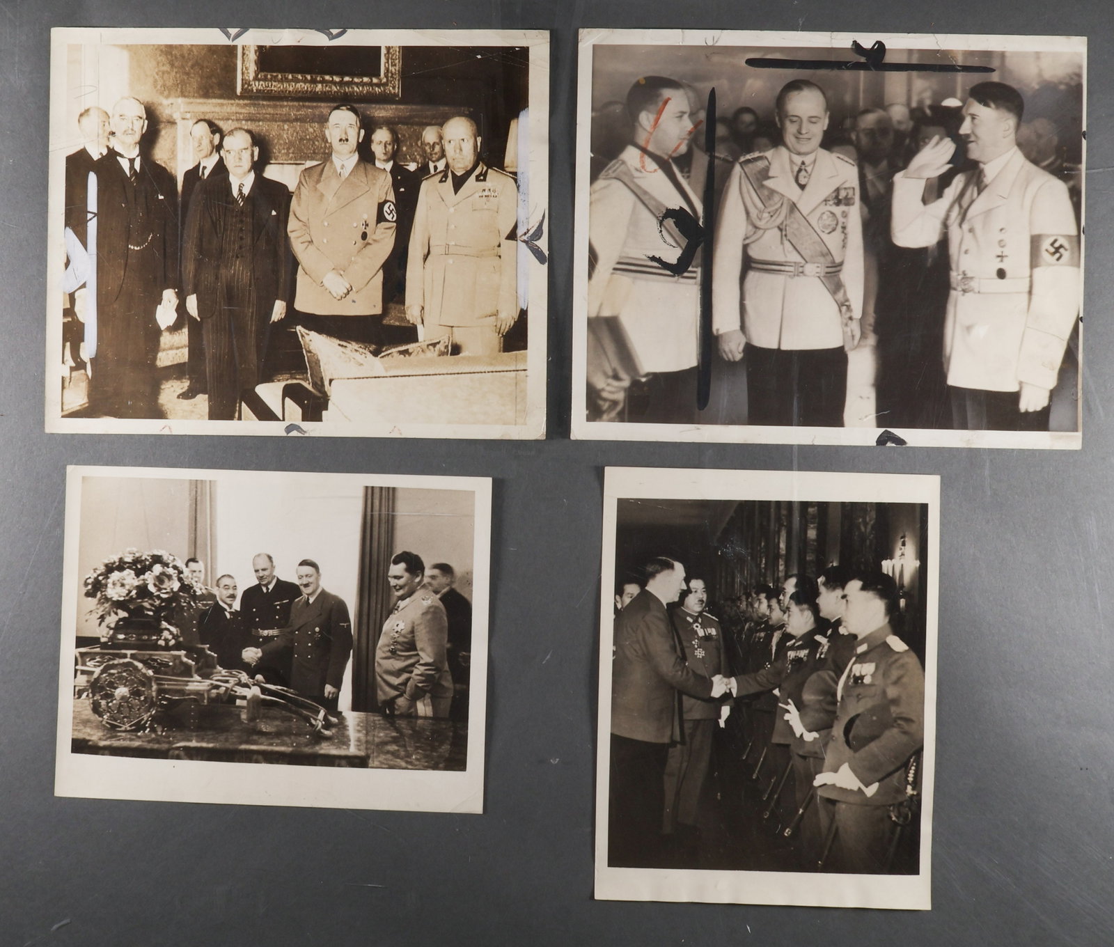 ADOLF HITLER MEETS FOREIGN DIGNITARIES (4): A fine lot of four contemporary press photographs, two 8 x 10 in., two 8.5 x 6.5 in., showing Hitler in various settings with foreign diplomats. These include: the four principle (including Hitler) at