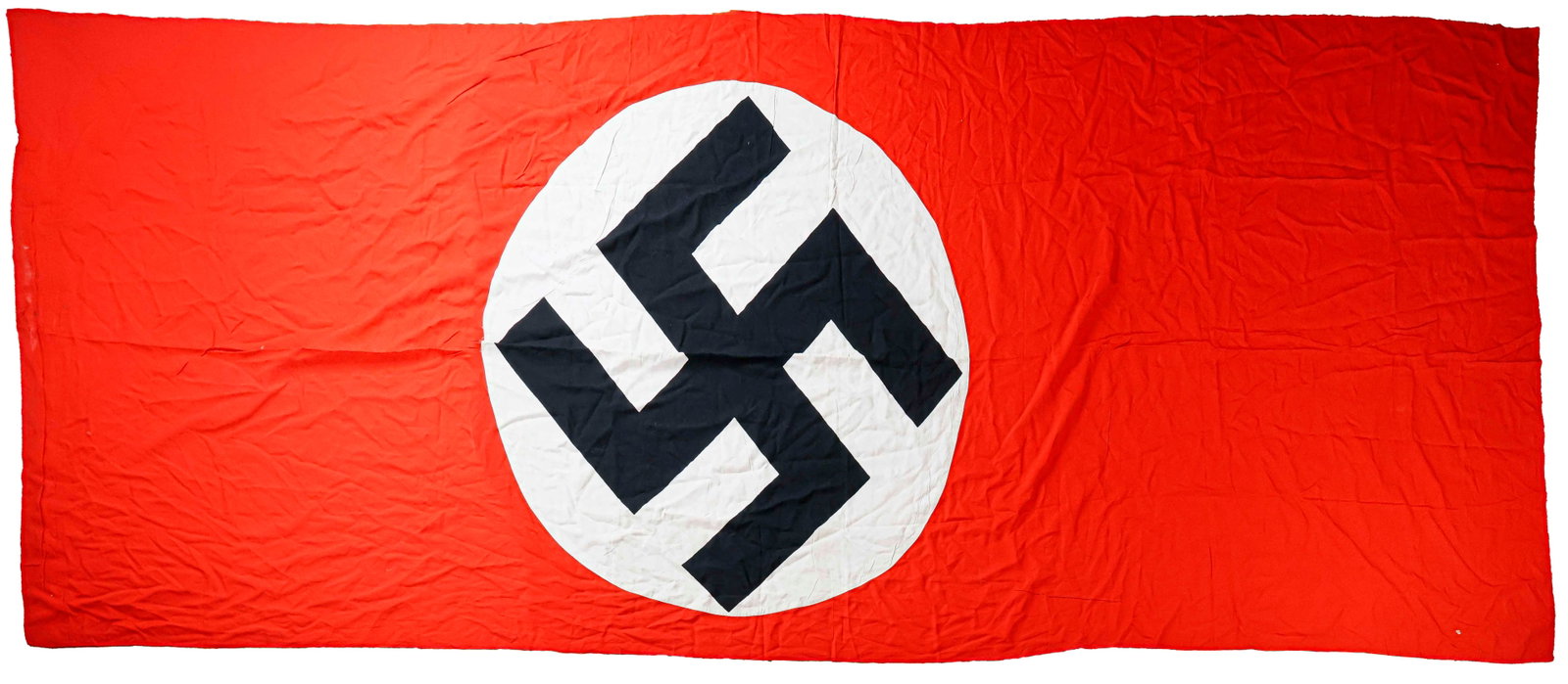 NSDAP BANNER: Large double-sided construction NSDAP banner, 153 x 54 in., bearing a red field with a printed black swastika on a sewn-on white disc. Minor tearing at the reinforced hoist edge, otherwise in very goo