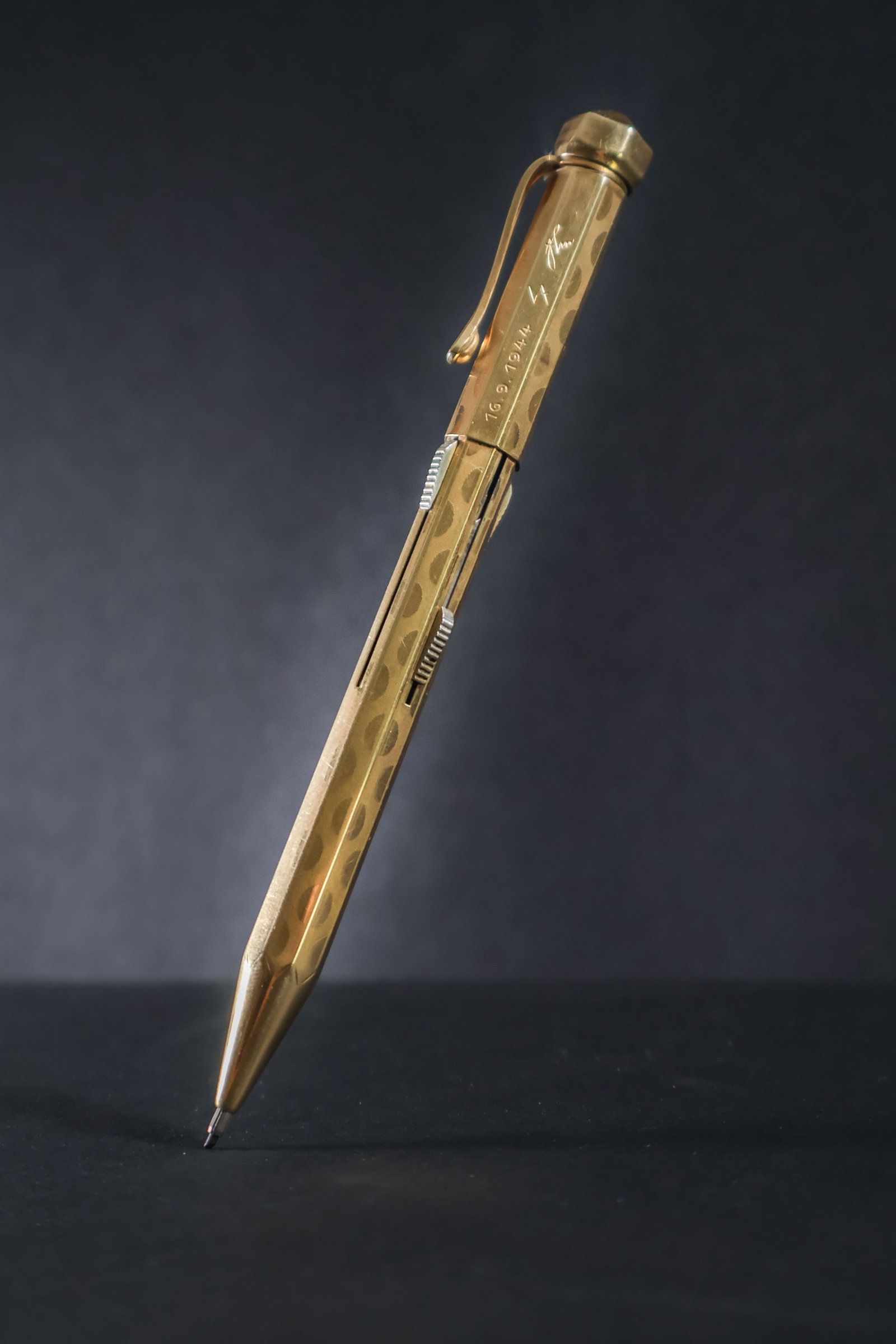 ADOLF HITLER GOLD MECHANICAL PENCIL, GIFTED TO EVA BRAUN'S FATHER: A simply incredible Adolf Hitler personal relic, a four-color gold presentation mechanical pencil gifted by Hitler to the father of his lover, Eva Braun, on the man's birthday in 1944. The beautifully
