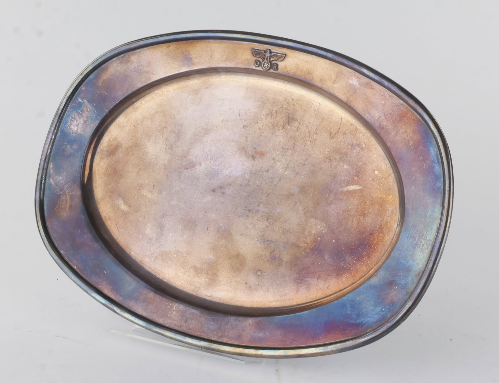 ADOLF HITLERíS SERVING TRAY FROM HIS PRIVATE TRAIN: Fine piece of Third Reich tableware, an Alpaka serving tray, 12 x 8 in., from the ëFuhrersonderzug', Hitler's private train. Featured at the top is a raised national eagle and swastika, flanked b