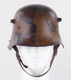 GERMAN MODEL 1916 CAMOUFLAGED COMBAT HELMET