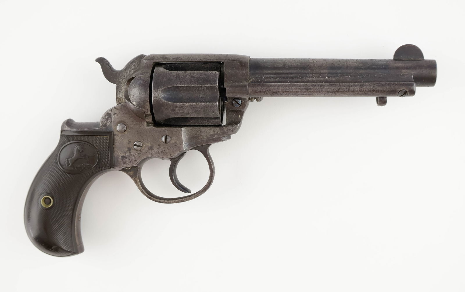 COLT MODEL 1877 DOUBLE ACTION REVOLVER: A .38 caliber colt model 1877 double action revolver, 9 in. long, nicknamed ‘Lightning’, the company’s first attempt at a double action revolver. Features a six-shot cylinder with long flutes, b