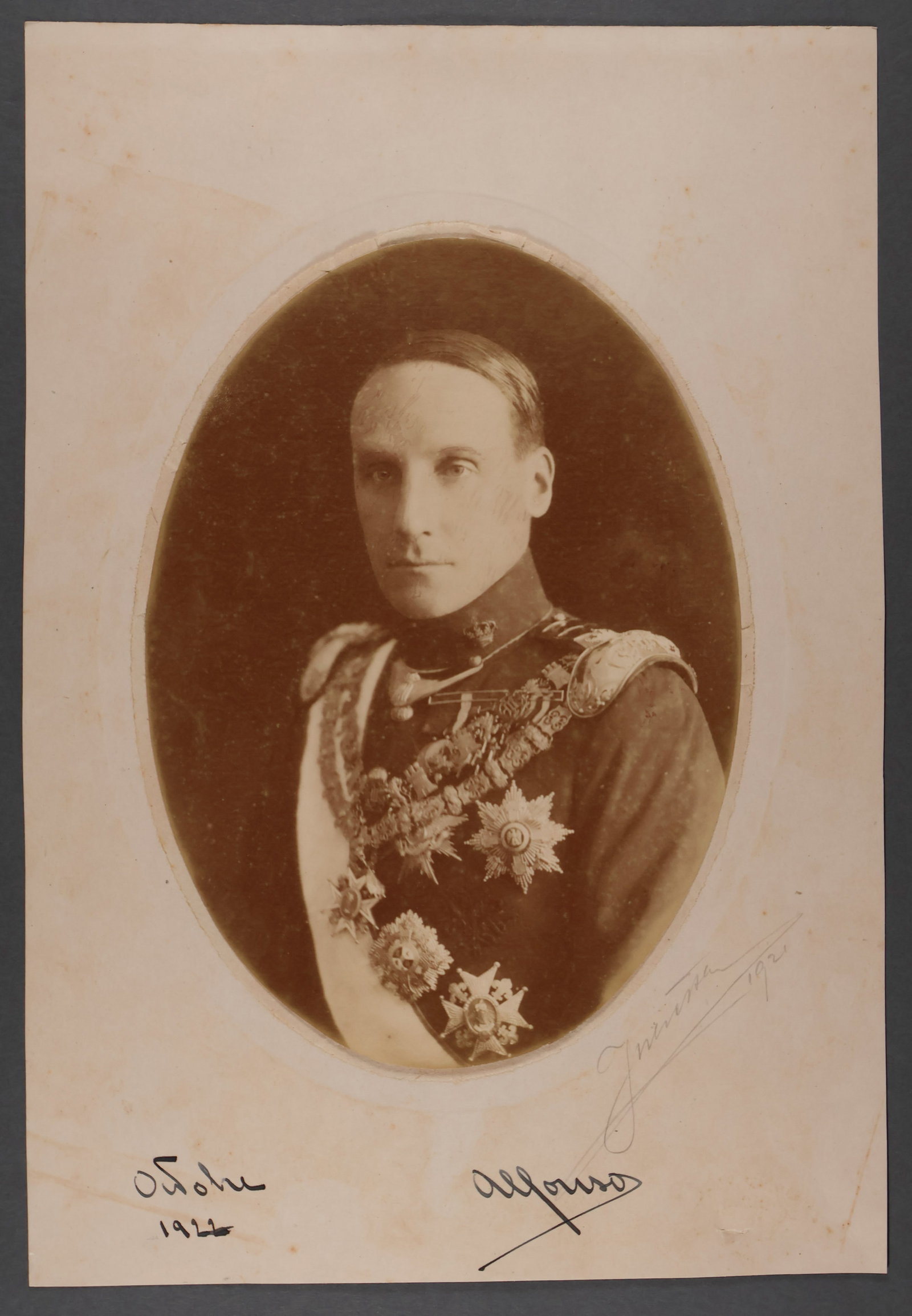 ALFONSO OF ORLEANS AND BOURBON: (1886-1975) Prince of Spain and fifth Duke of Galliera. S.P., 8.5 x 12.5 in. sepia, a noble image showing him in regal attire. Mounted to cardstock. Signed at the bottom margin, adding the year ë
