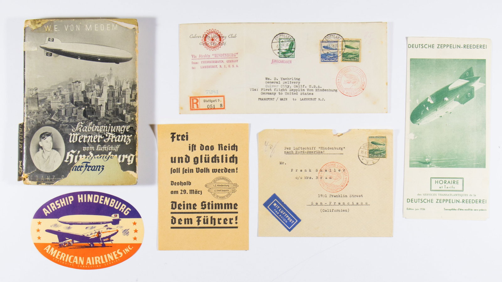 ZEPPELIN EPHEMERA GROUPING: A fine grouping of ephemera, all related to the zeppelin 'Hindenburg' and other German airships. Included is: a Hitler election handbill using the Hindenburg and Graf Zeppelin to promote his 1936 Reic