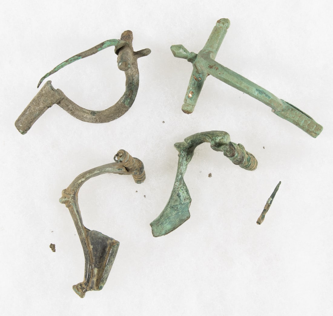 ROMAN 'CROSSBOW' FIBULAE: A lot of four well preserved bronze Roman brooches or 'fibulae', all roughly 4 in. long, recovered from Gaul (now modern France), 2nd-3rd century, each resembling a crossbow. These brooches would have