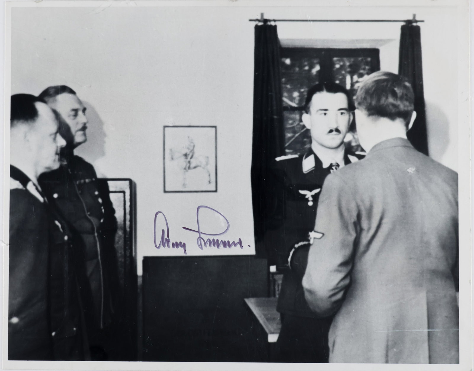 ADOLF GALLAND: (1911 - 1994) German fighter ace of World War II and general of fighters. S.P. 10 x 8 in. b/w, an image of Galland shaking hands with Adolf Hitler (back to the camera), as generals Keitel and Milch lo