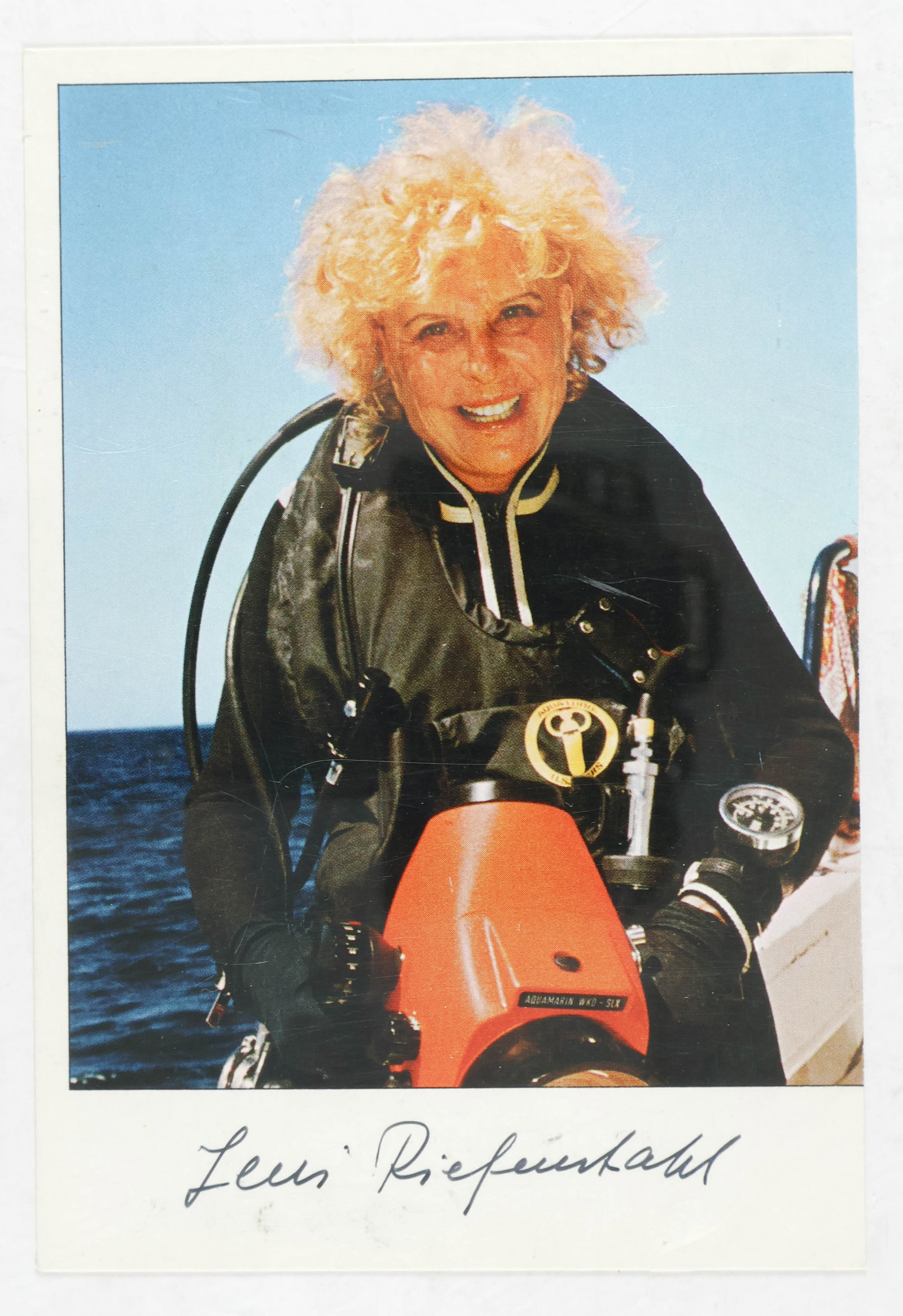 LENI RIEFENSTAHL: (1902 - 2003) German film director, an intimate friend of Hitler who filmed the propaganda classic, 'Triumph of the Will'. S.P., 4 x 5.75 in. color, an image of Riefenstahl later in life wearing a wet