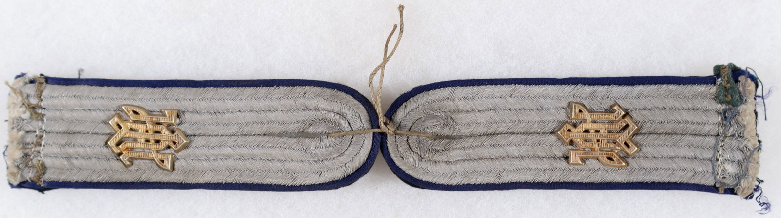 WAFFEN-SS 'LIEBSTANDARTE ADOLF HITLER' MEDICAL SHOULDER BOARDS: Very rare pair of Waffen-SS Sturmfuhrer shoulder boards for an medical officer in the service of '1. Division SS-Liebstandarte Adolf Hitler', as indicated by the attached guilt 'LAH' cyphers. The boar