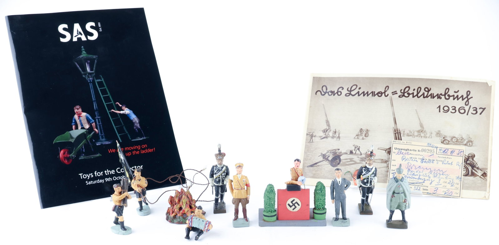 WORLD II GERMAN TOY THIRD REICH FIGURES AND LINEOL CATALOG: An incredibly rare and desirable group of eight German Lineol Elastolin toy figures from World War II, measuring from 1.75 in. to 3 in. tall. Of particular note are three standing figures of Hitler, G