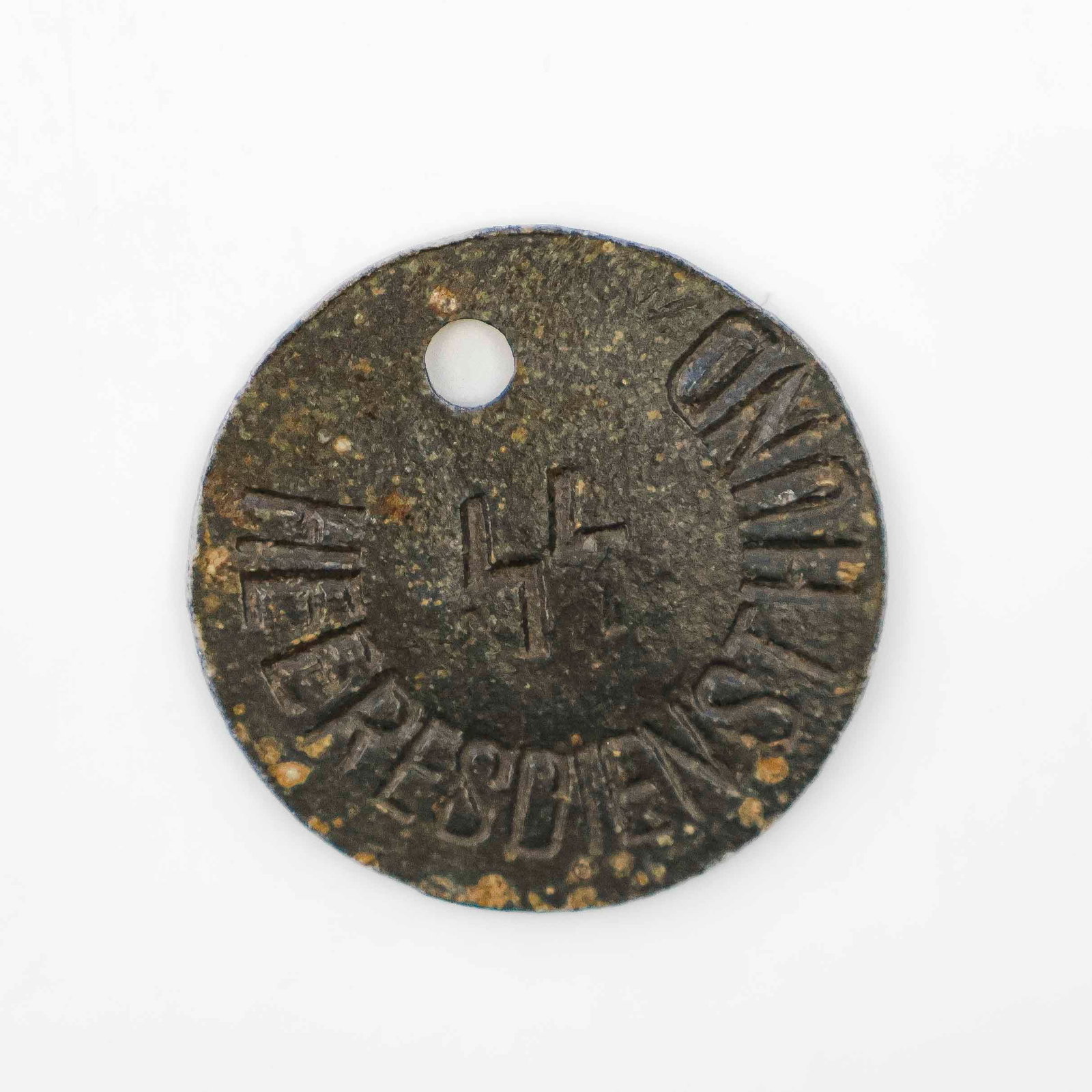 IDENTIFICATION TAG FOR SS WAR SERVICE DOG: An exceptionally rare World War II relic, an identification tag for an SS service dog, 1 in. dia., stamped with the SS runes, further marked ‘HeeresHeeresdiensthund’ (‘Army Service D